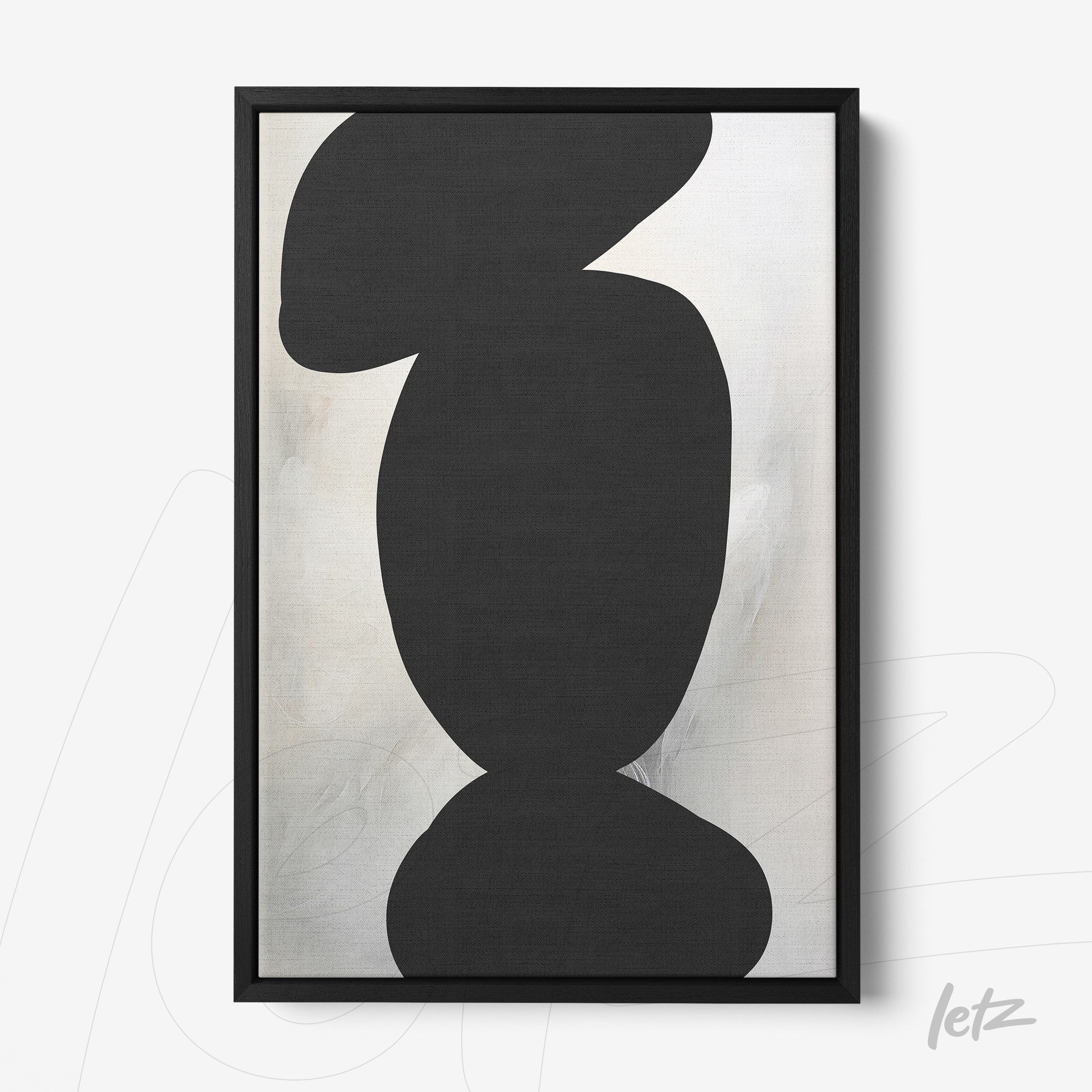 abstract wall art in black and white with a slim black frame and light background
