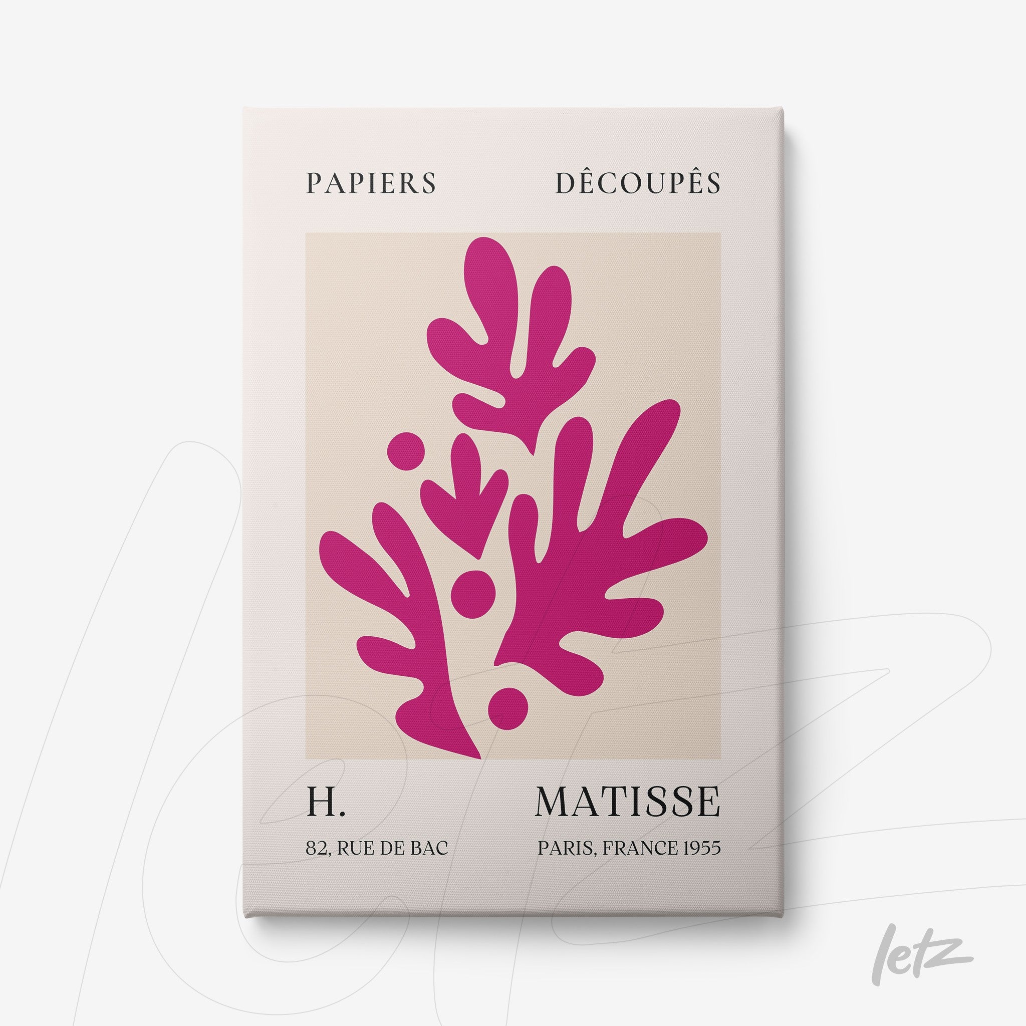 framed wall art featuring modern stylized shapes in pink on a cream background with a white frame