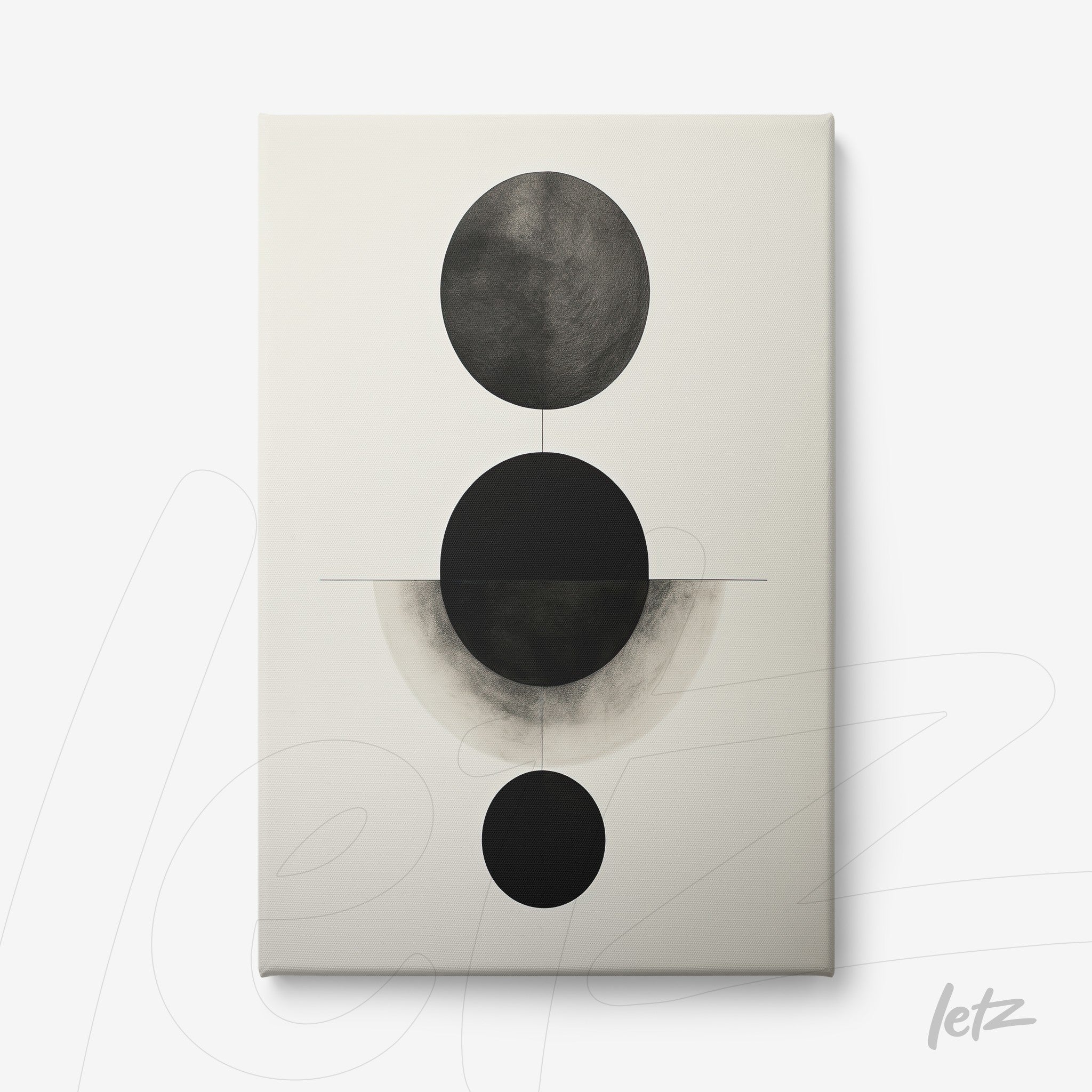 canvas artwork featuring abstract black and white design with circles of varying sizes on a light background