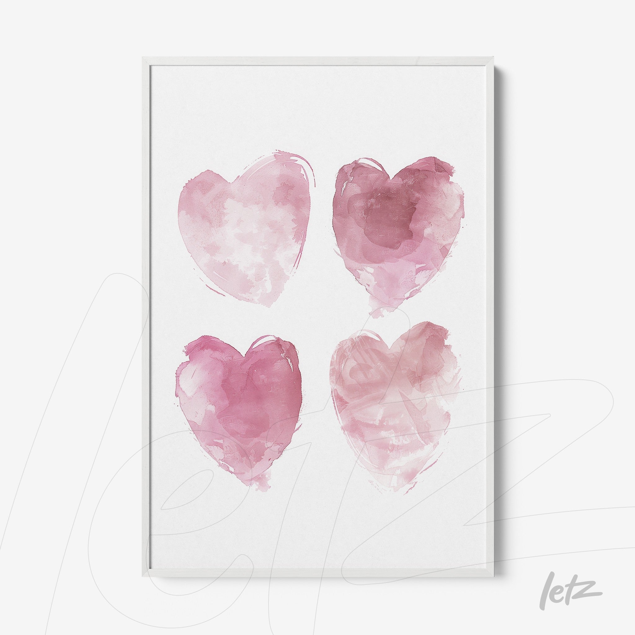 framed artwork featuring four watercolor hearts in shades of pink on a white background
