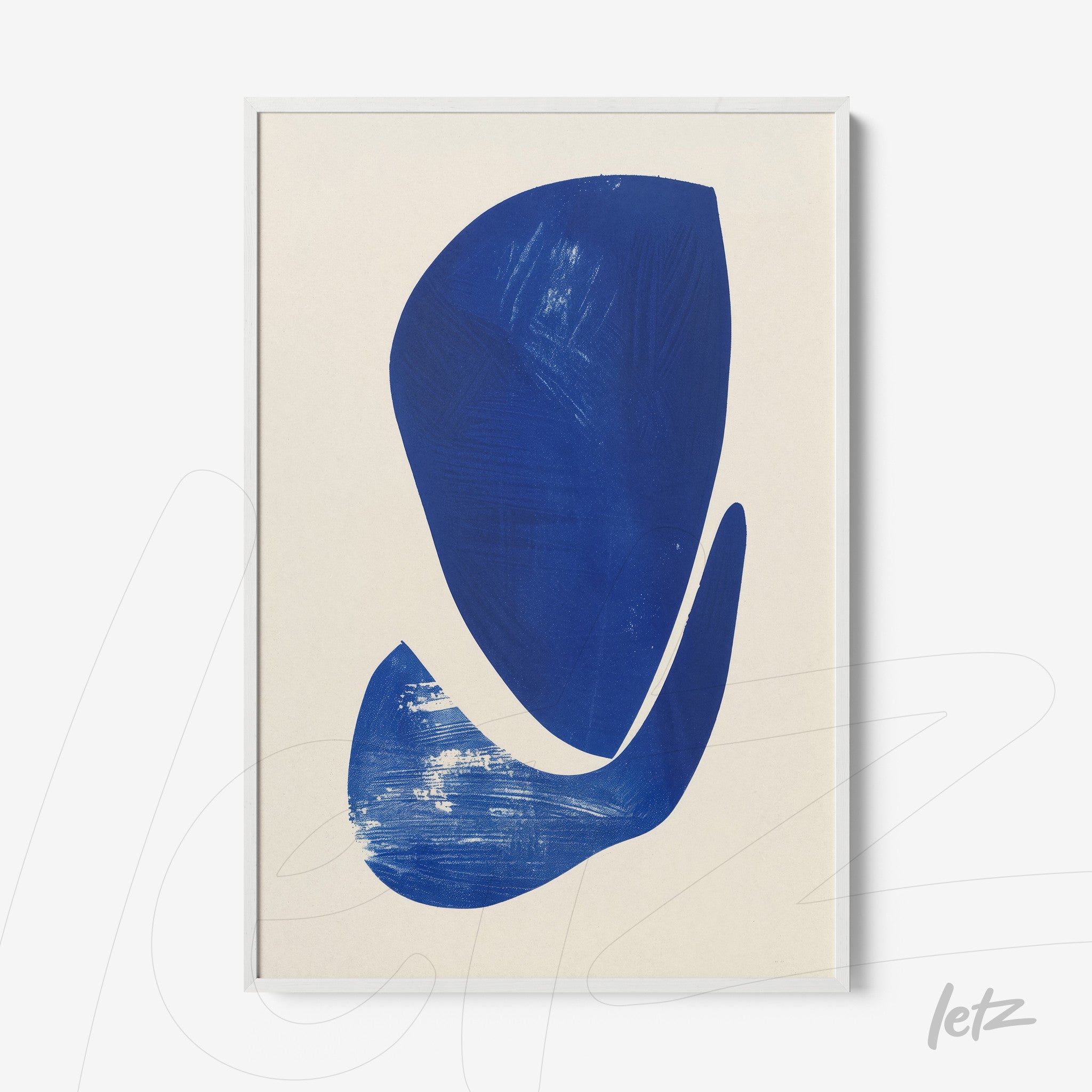 framed abstract art piece in deep blue with white frame