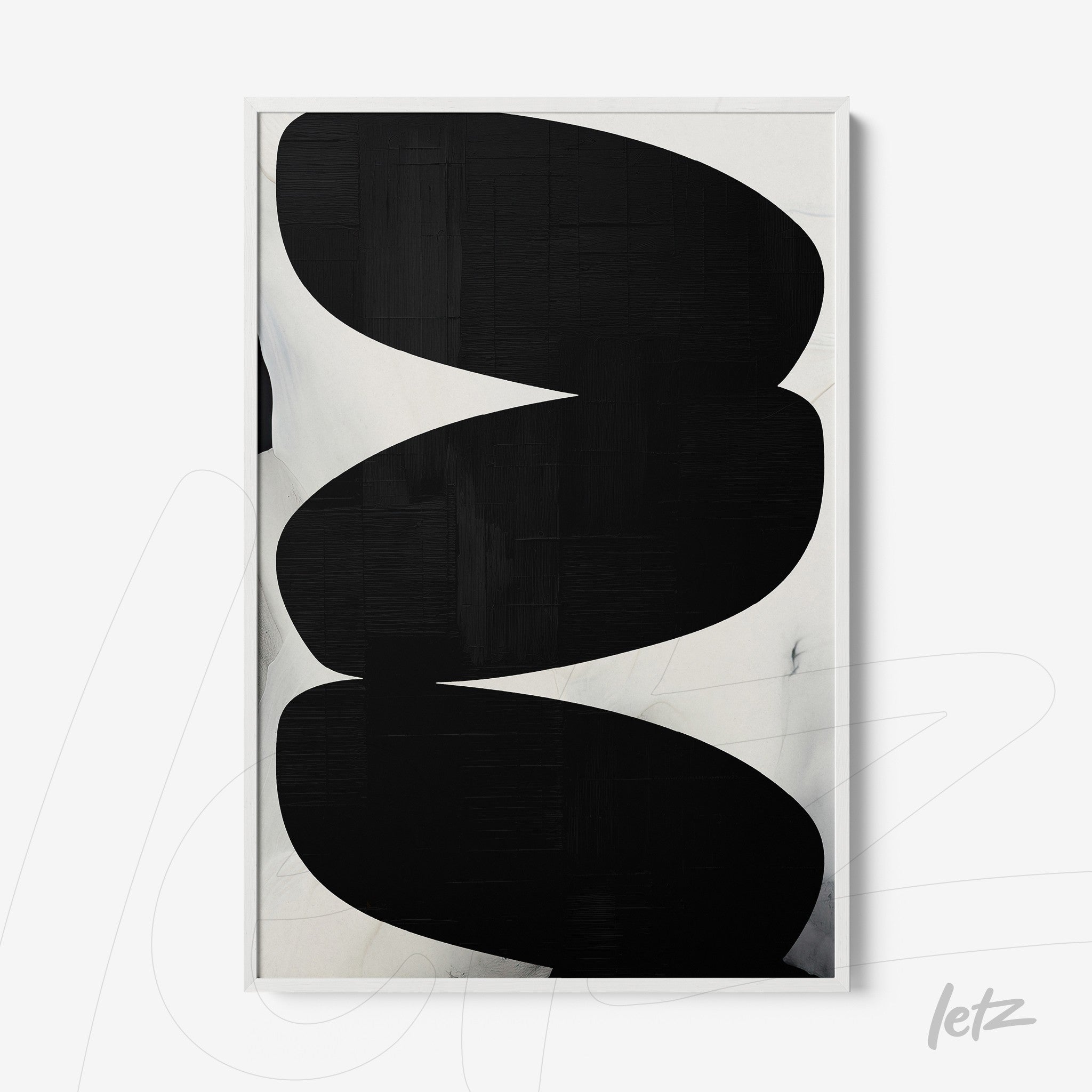 framed wall art featuring abstract black shapes on a light background
