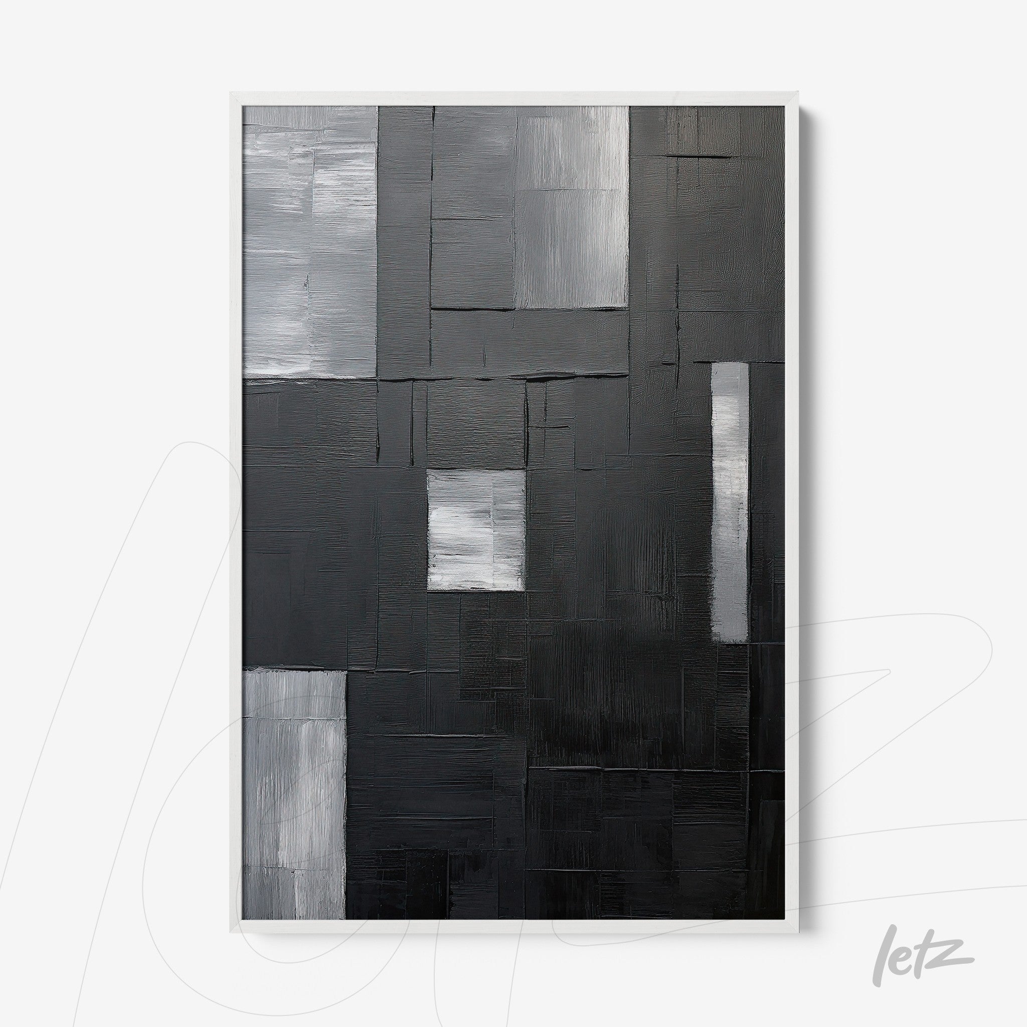abstract wall art in shades of black and gray with textured relief in a white frame