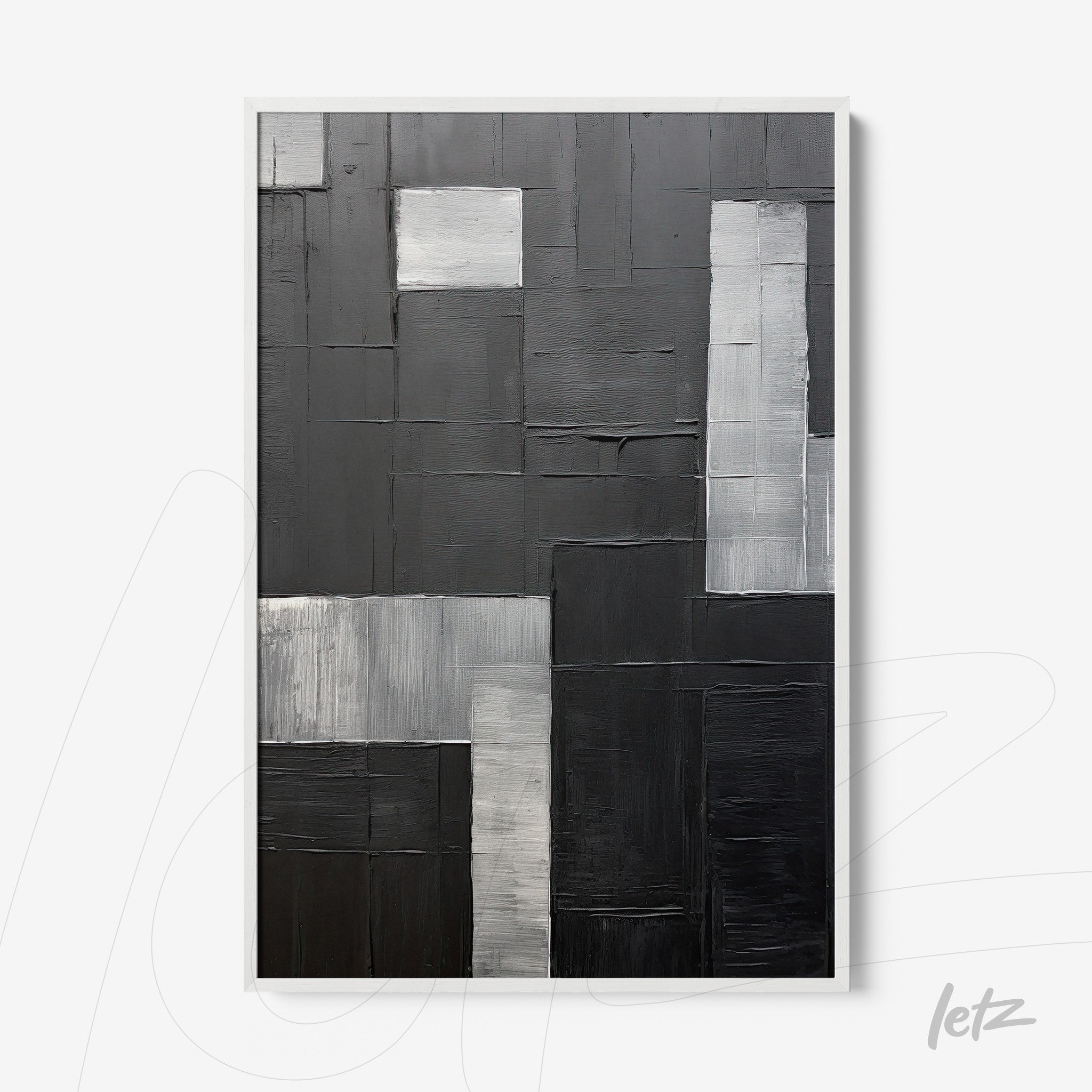 abstract wall art in black and white featuring textures in various shades of gray framed in white