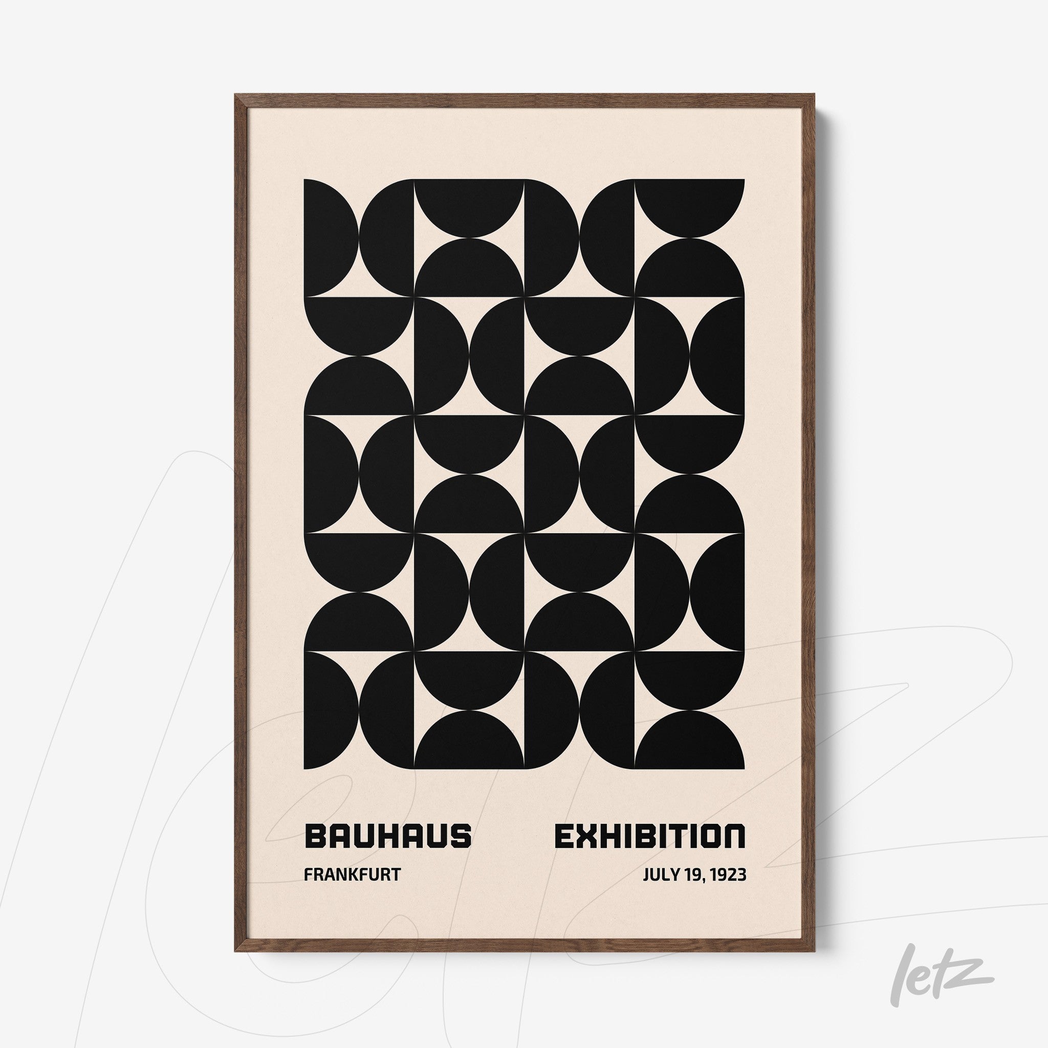 poster print with black and white geometric art, wooden frame, and text about Bauhaus exhibition