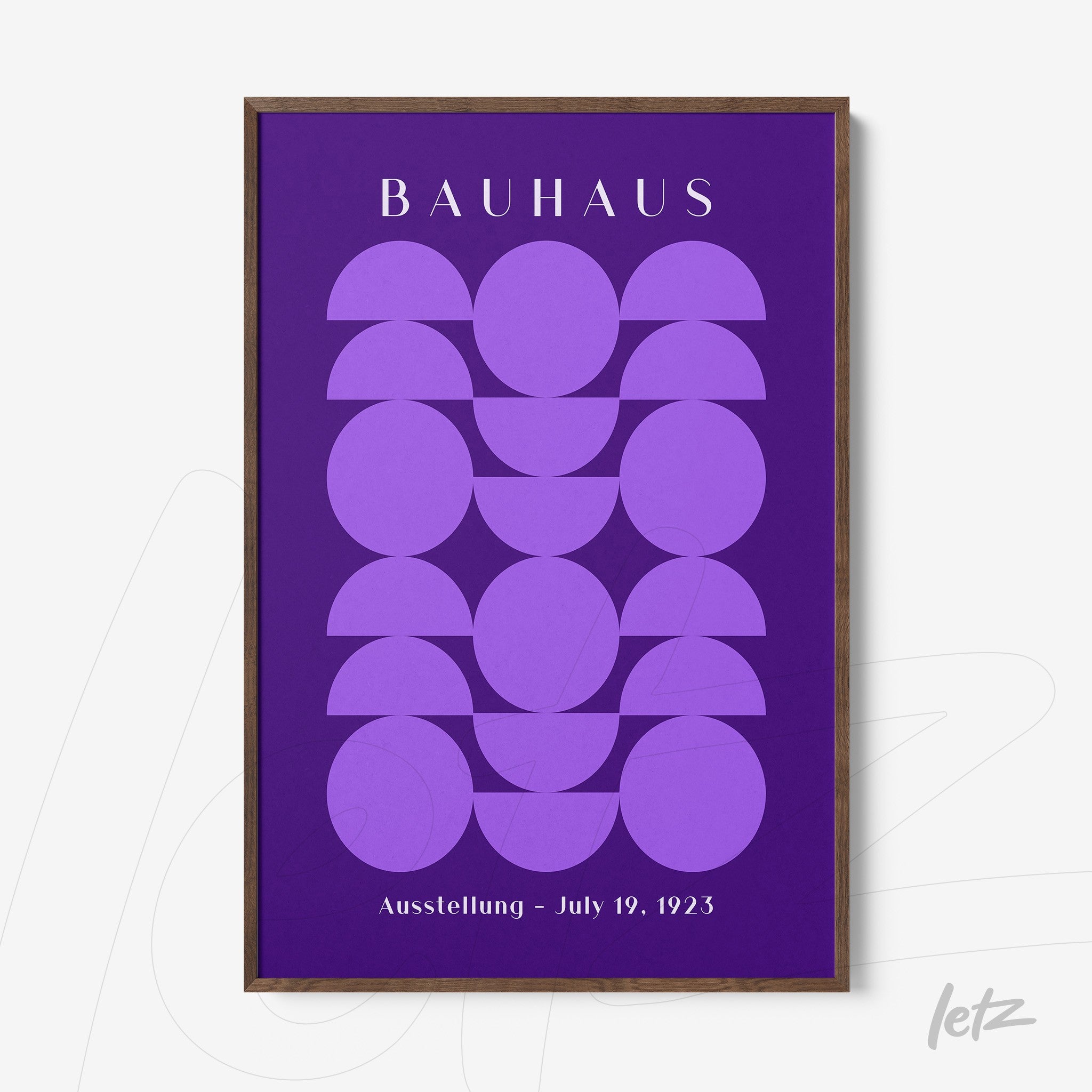 modern framed wall art with purple geometric shapes and bauhaus text in dark wood frame