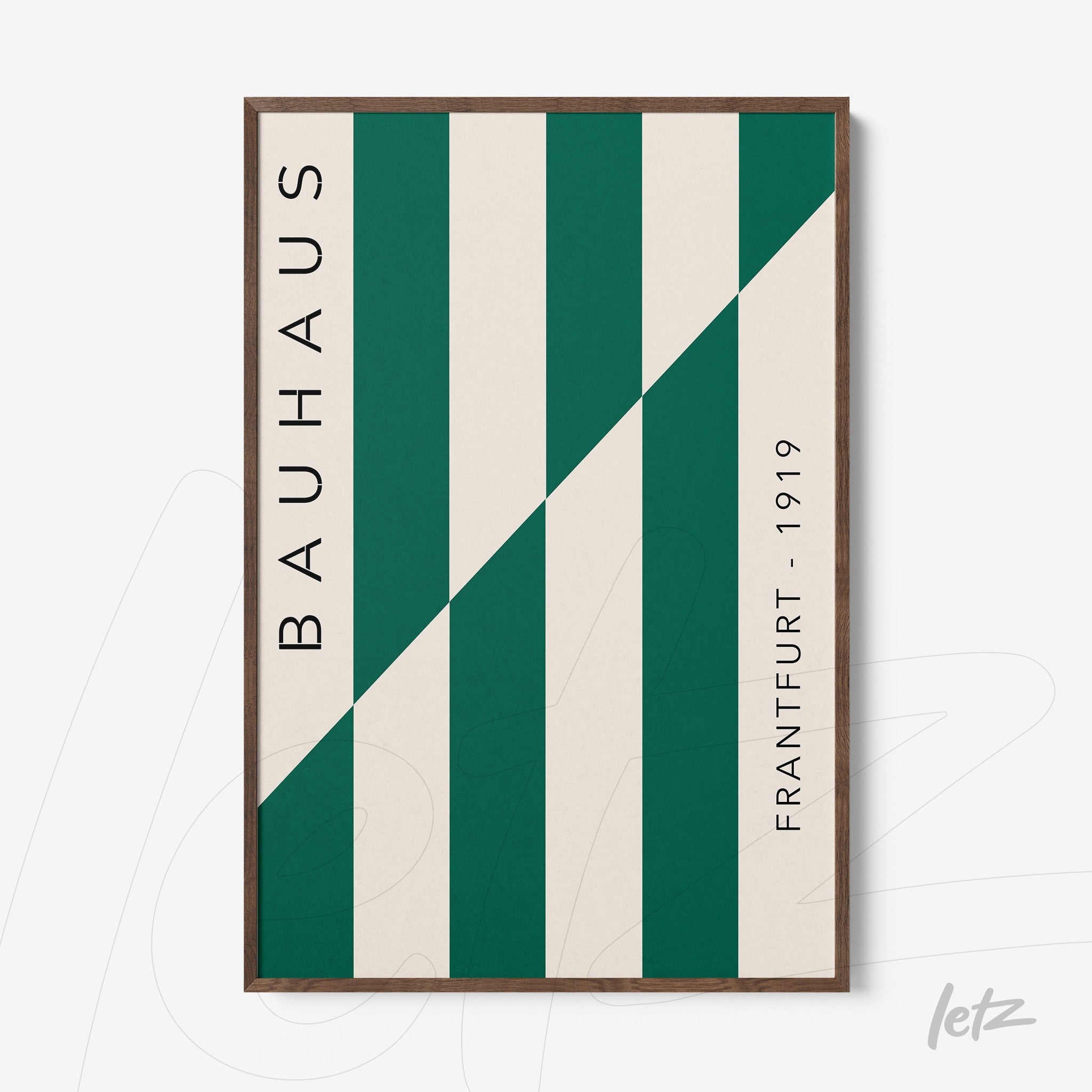 poster print featuring geometric design in green and cream, dark wood frame, vertical text 'Bauhaus' and 'Frankfurt - 1919'