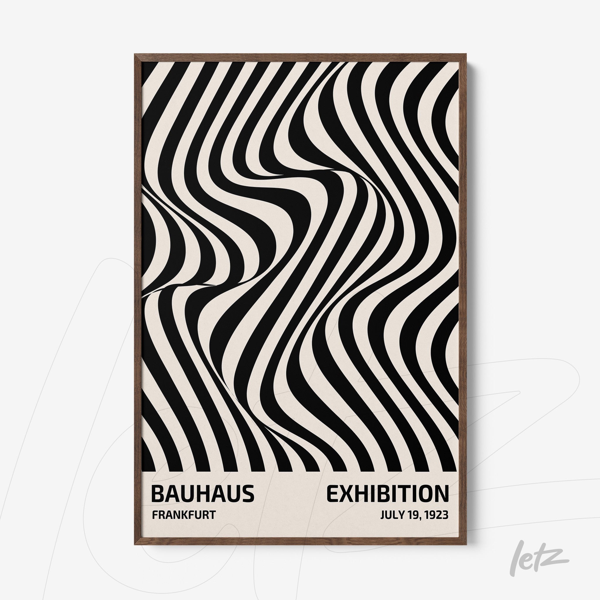 black and white geometric design print with light wood frame