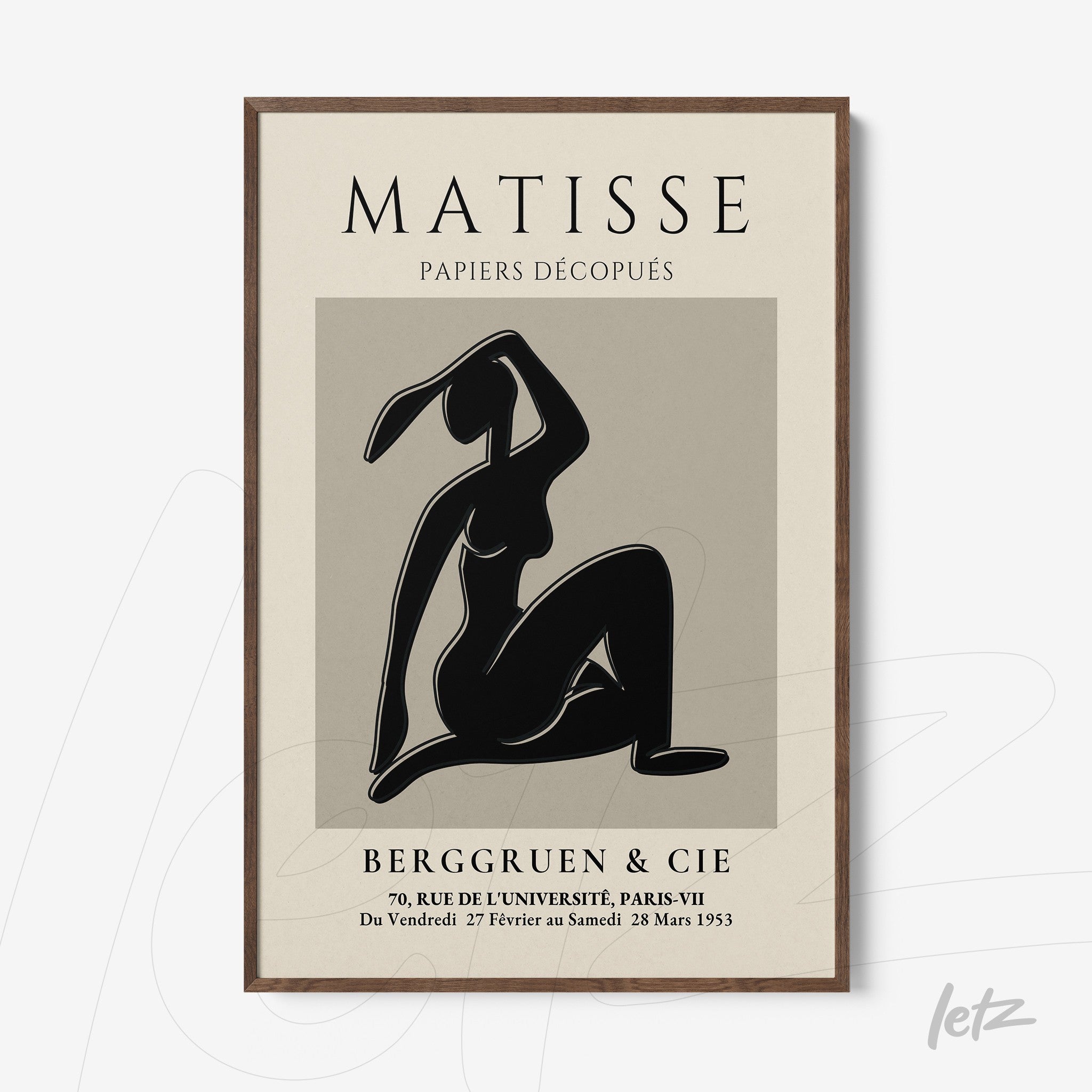 decorative wall art featuring paper cutout of a female figure in black background, dark wood frame with minimalist design