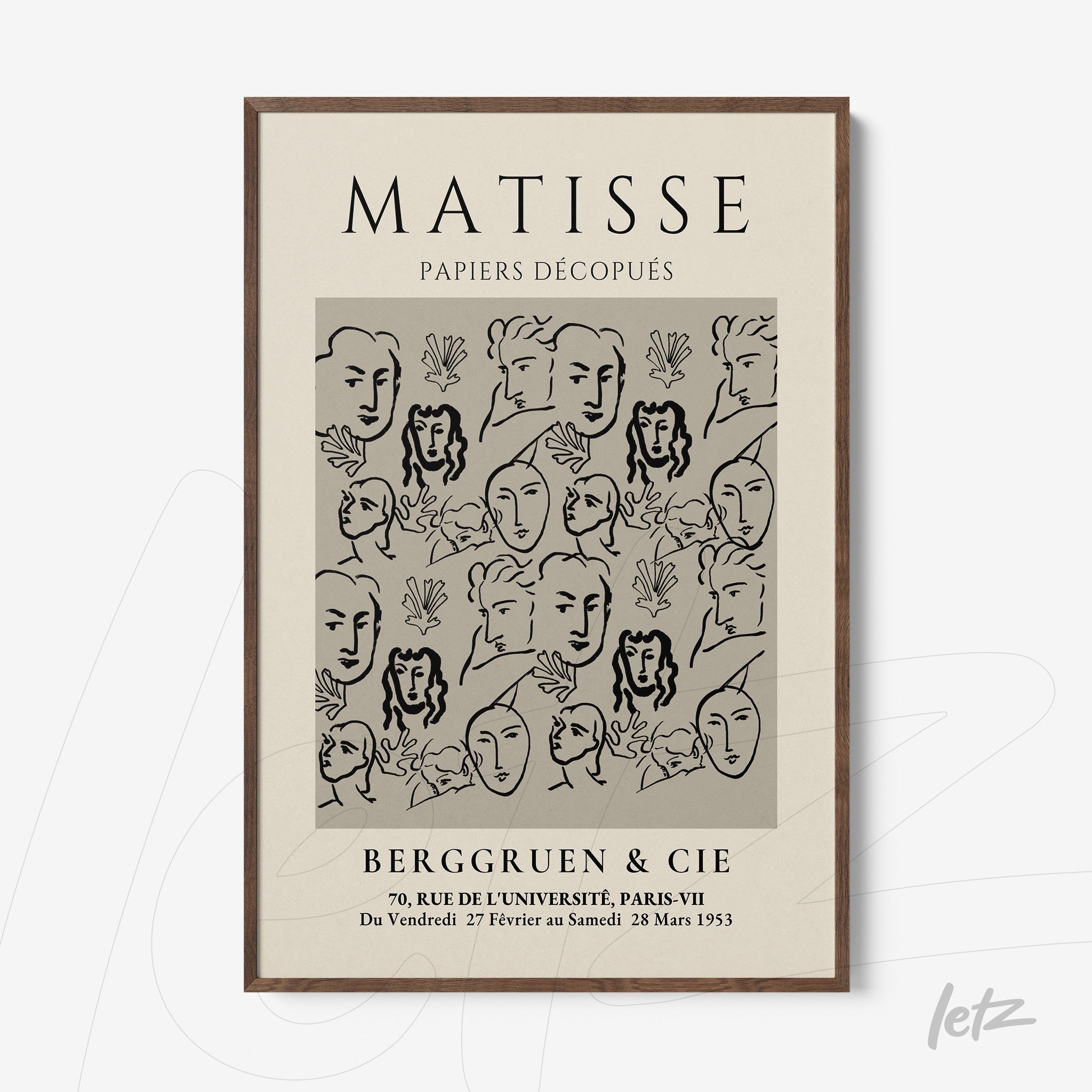 framed artwork featuring abstract black and white design with stylized faces and botanical elements, dark wood frame