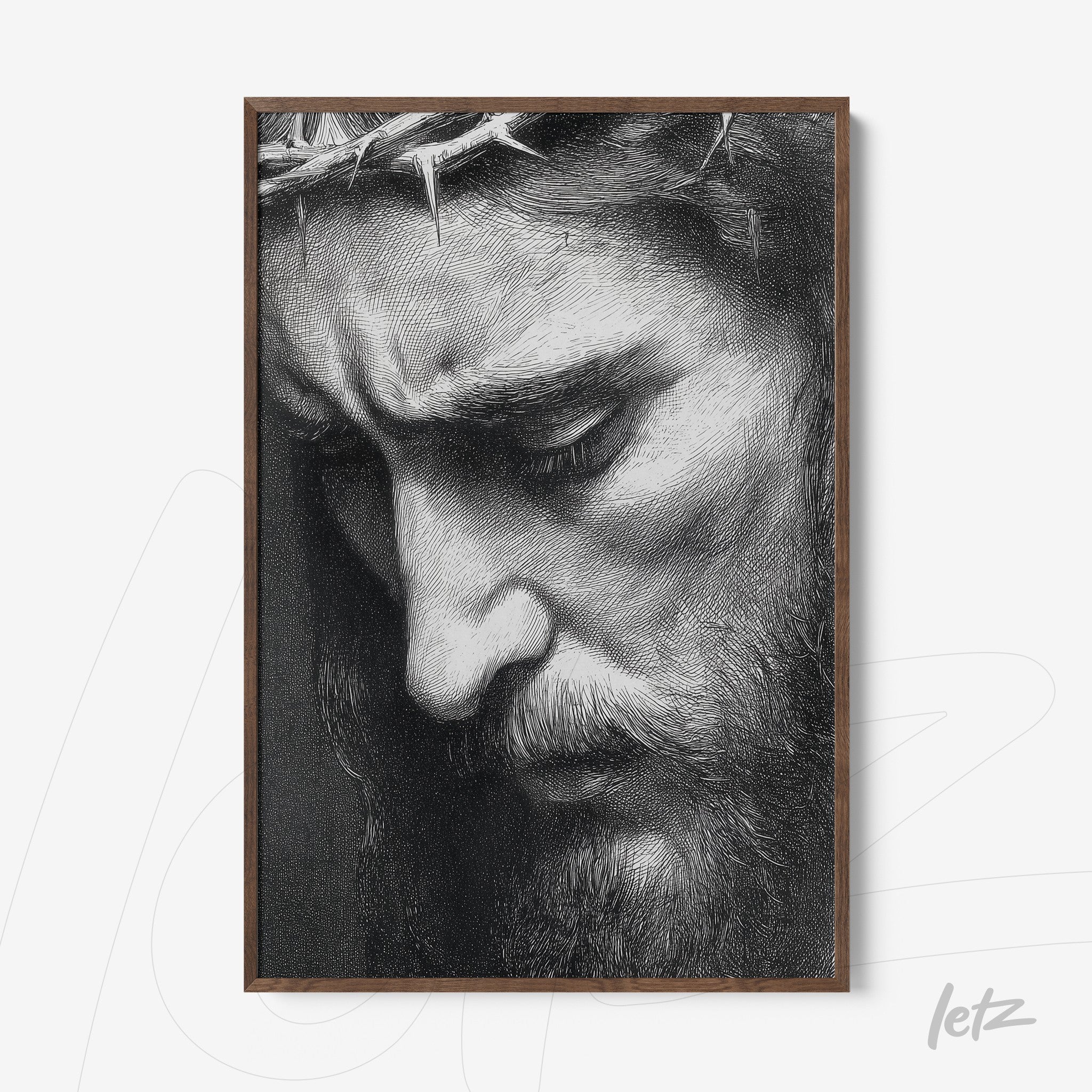 framed artwork featuring a detailed black and white portrait of a male face with a melancholic expression and dark wood frame