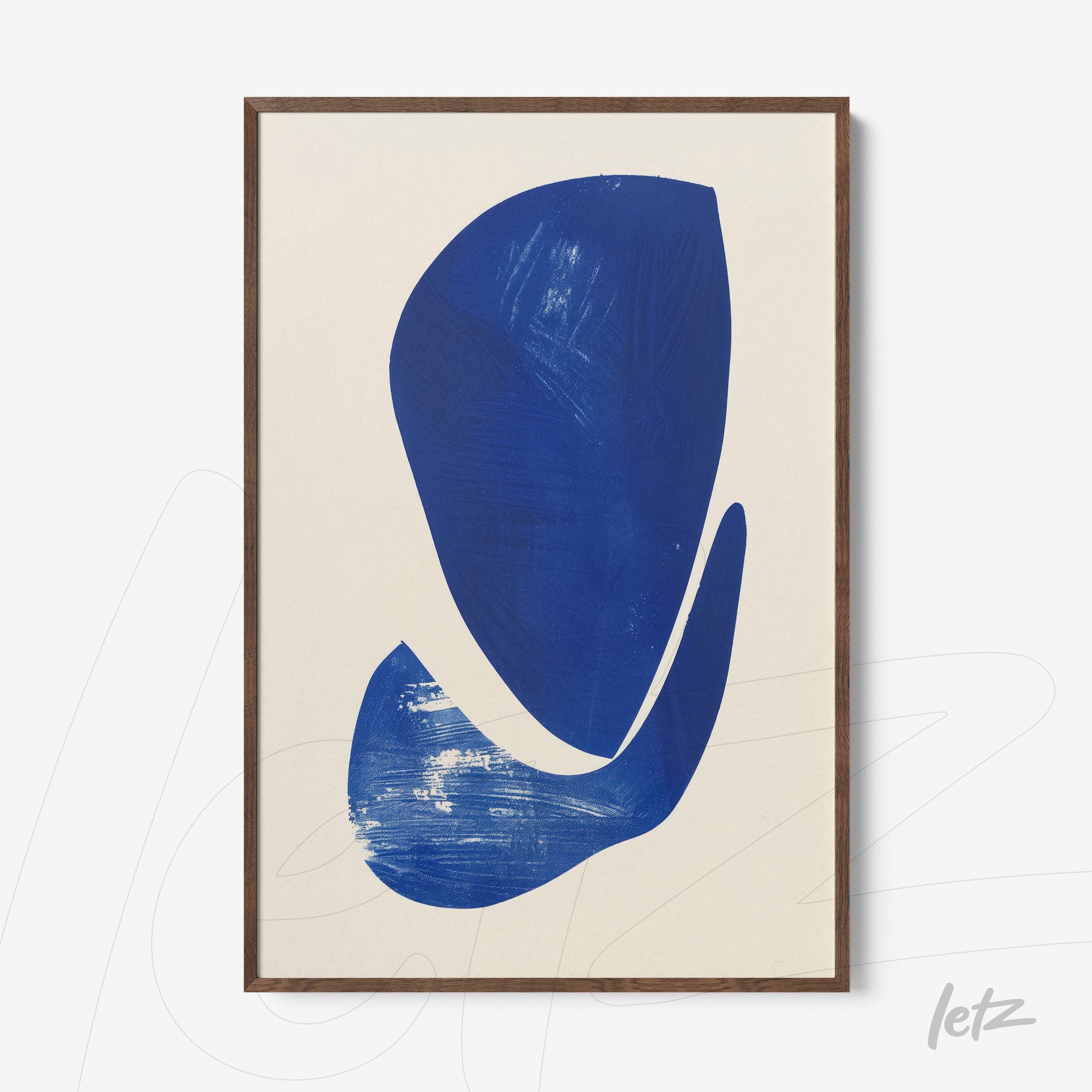 abstract wall art in blue tones framed in dark wood