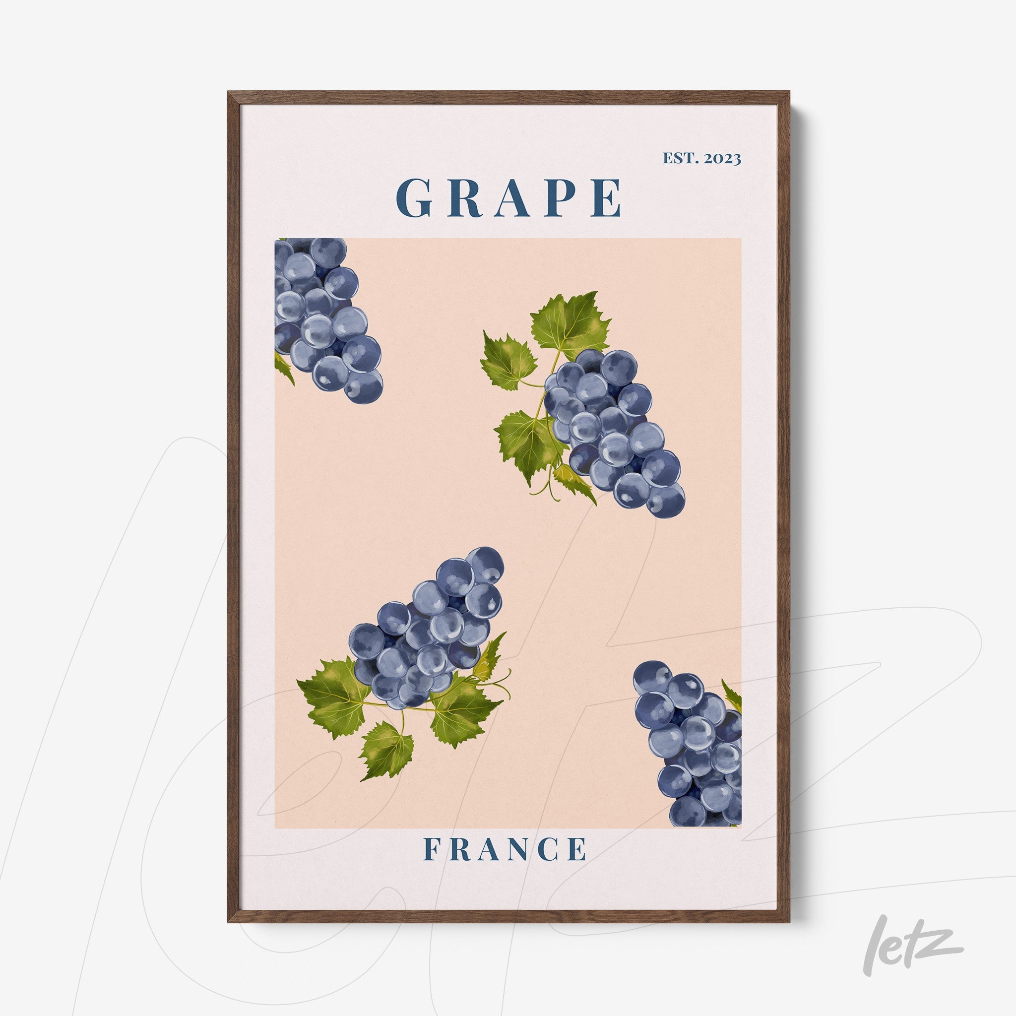 framed art print featuring large grapes on a soft pink background with dark wood frame