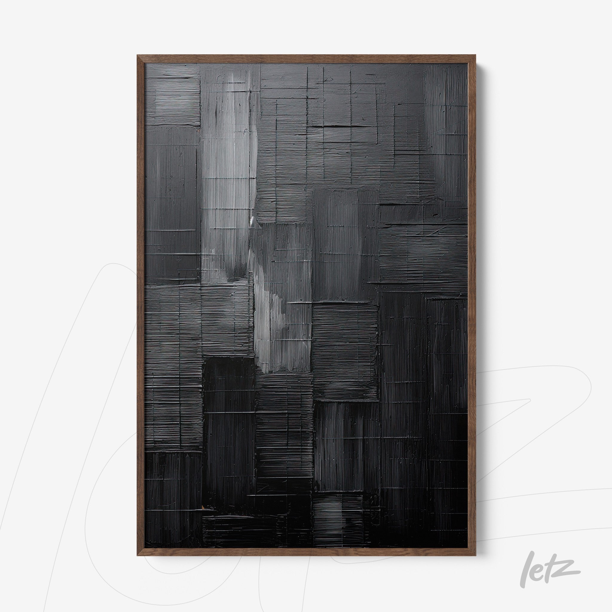 abstract black artwork featuring textured relief and dark wood frame