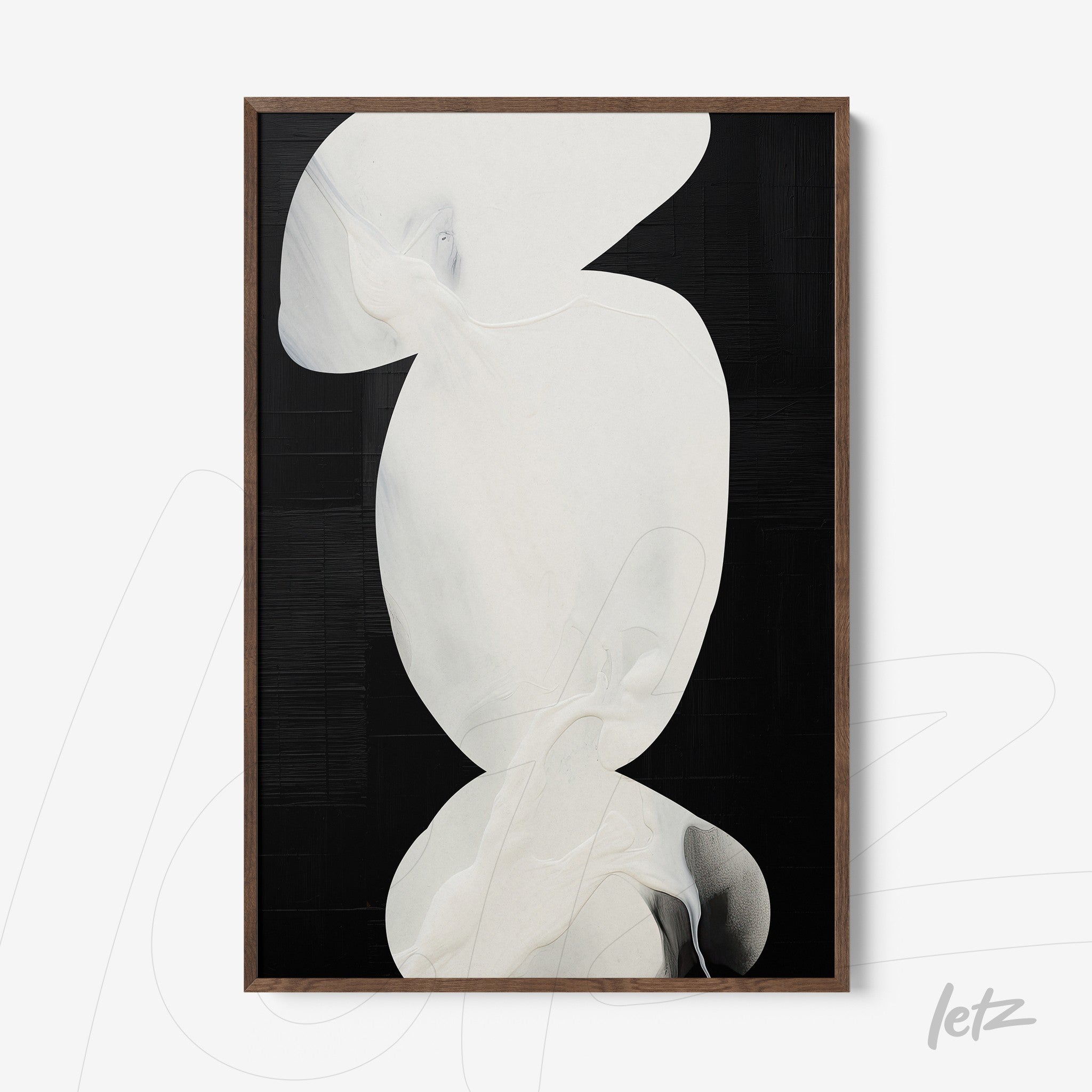 abstract wall art in white and black with dark wooden frame