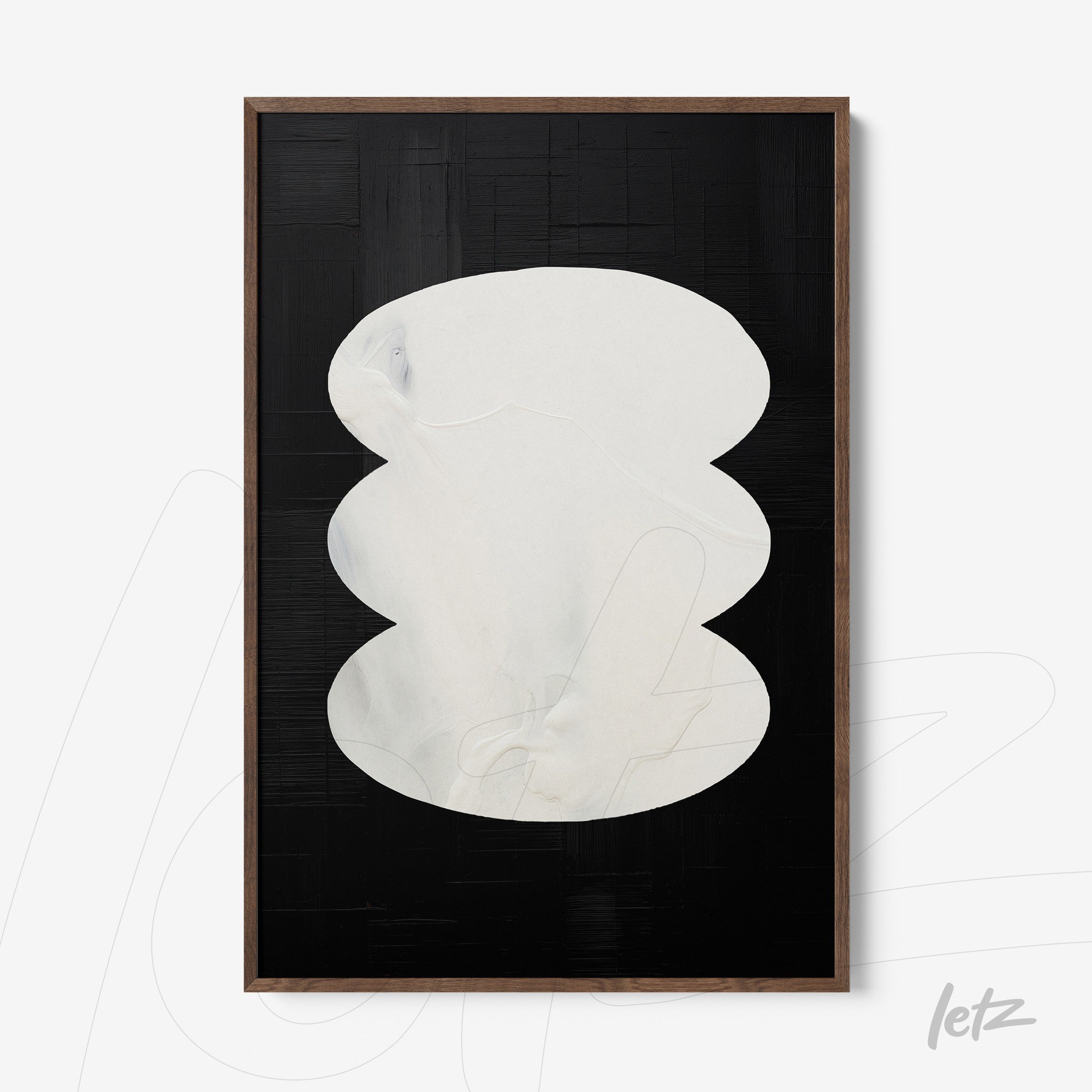 modern wall art featuring organic white shapes on a black background in a dark wood frame