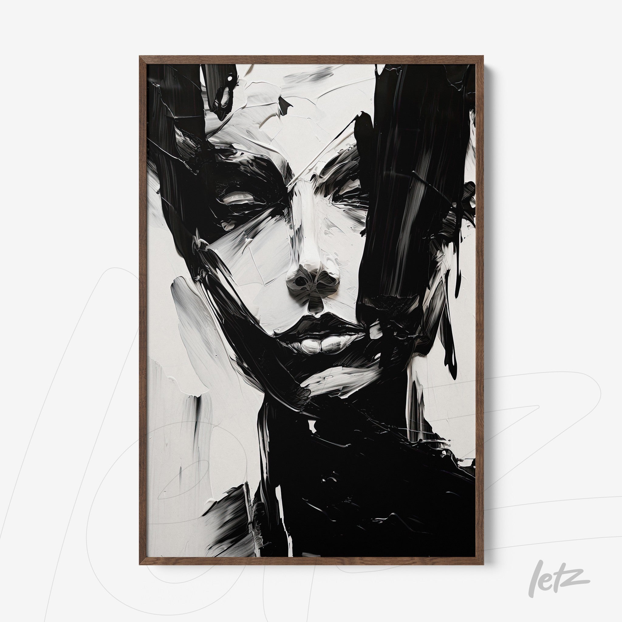 abstract wall art in black and white depicting a human face in a light wooden frame