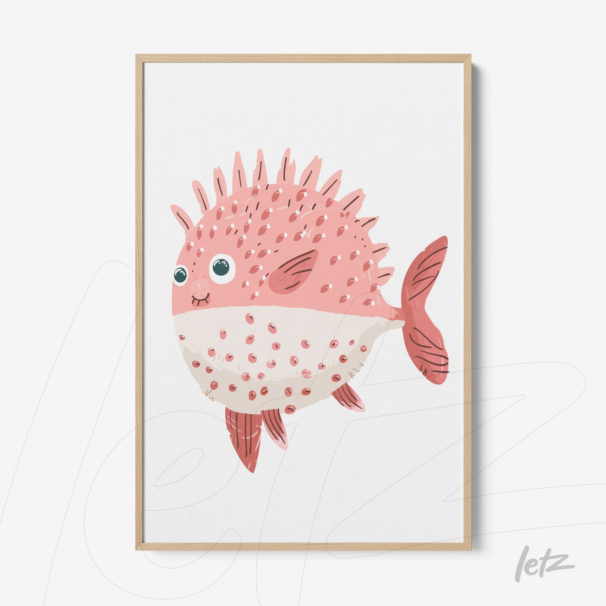 framed wall art featuring a colorful illustration of a spiky pink fish with light wood frame