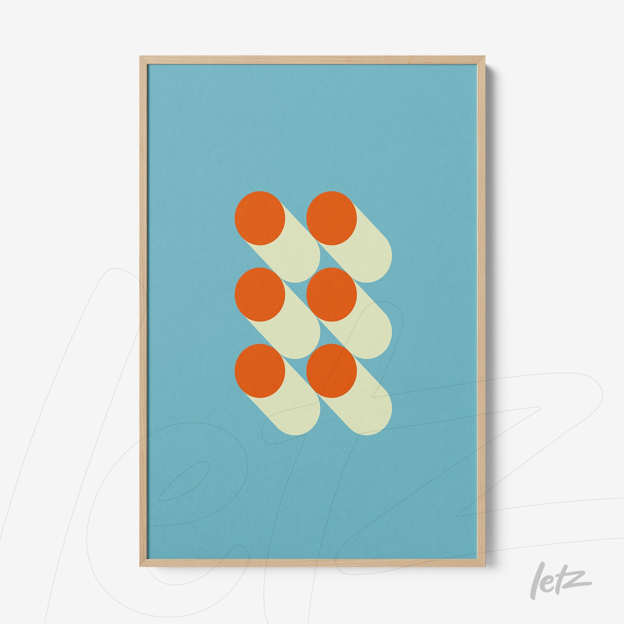 canvas featuring geometric art with orange circles and yellow shadows on a blue background, framed in light wood