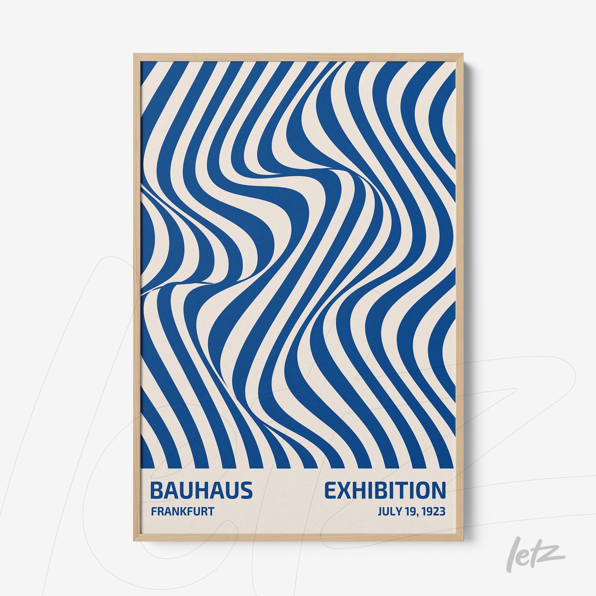 poster with blue and white geometric pattern in bauhaus style framed in light wood