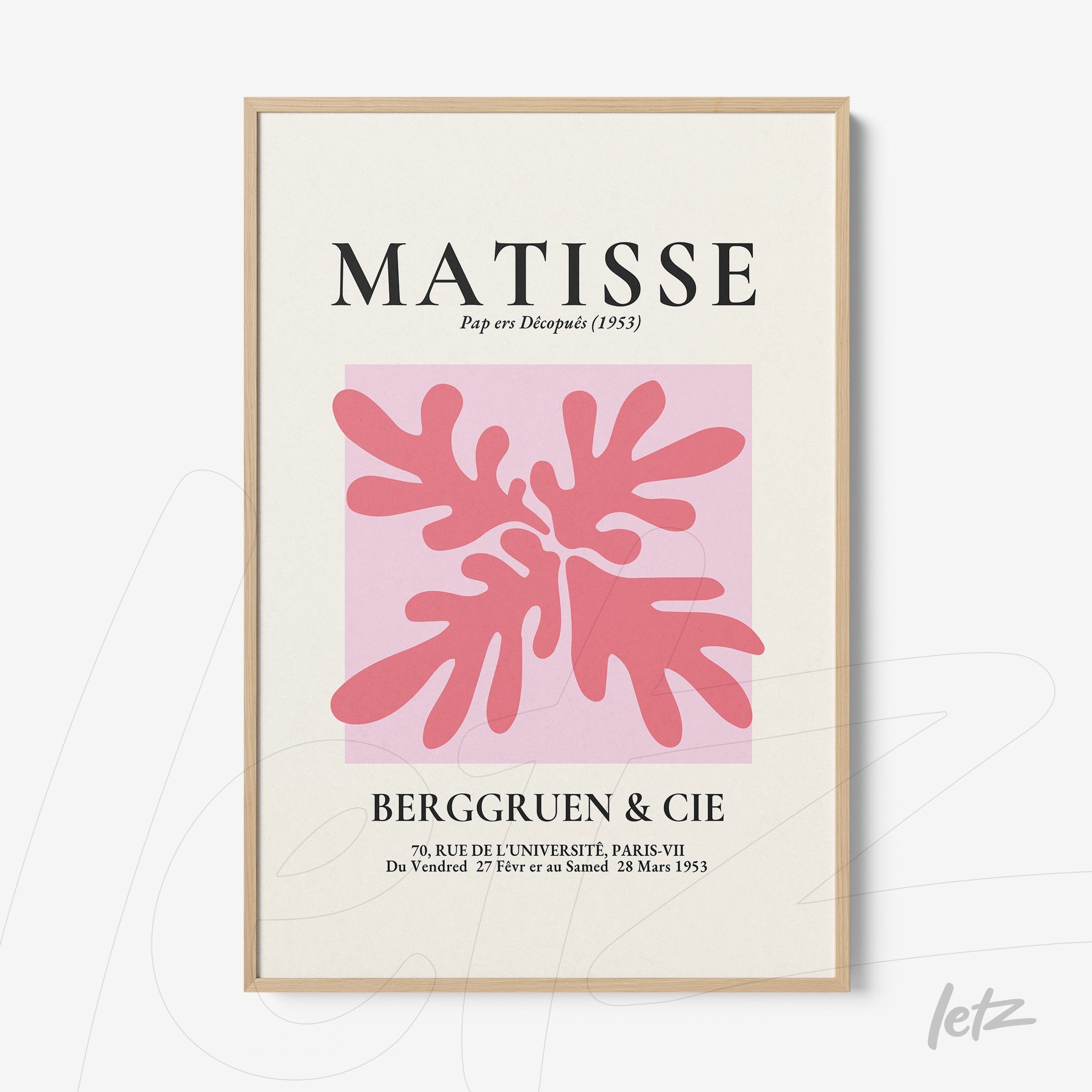 modernist wall art featuring pink and red shapes with light wood frame and soft pink background