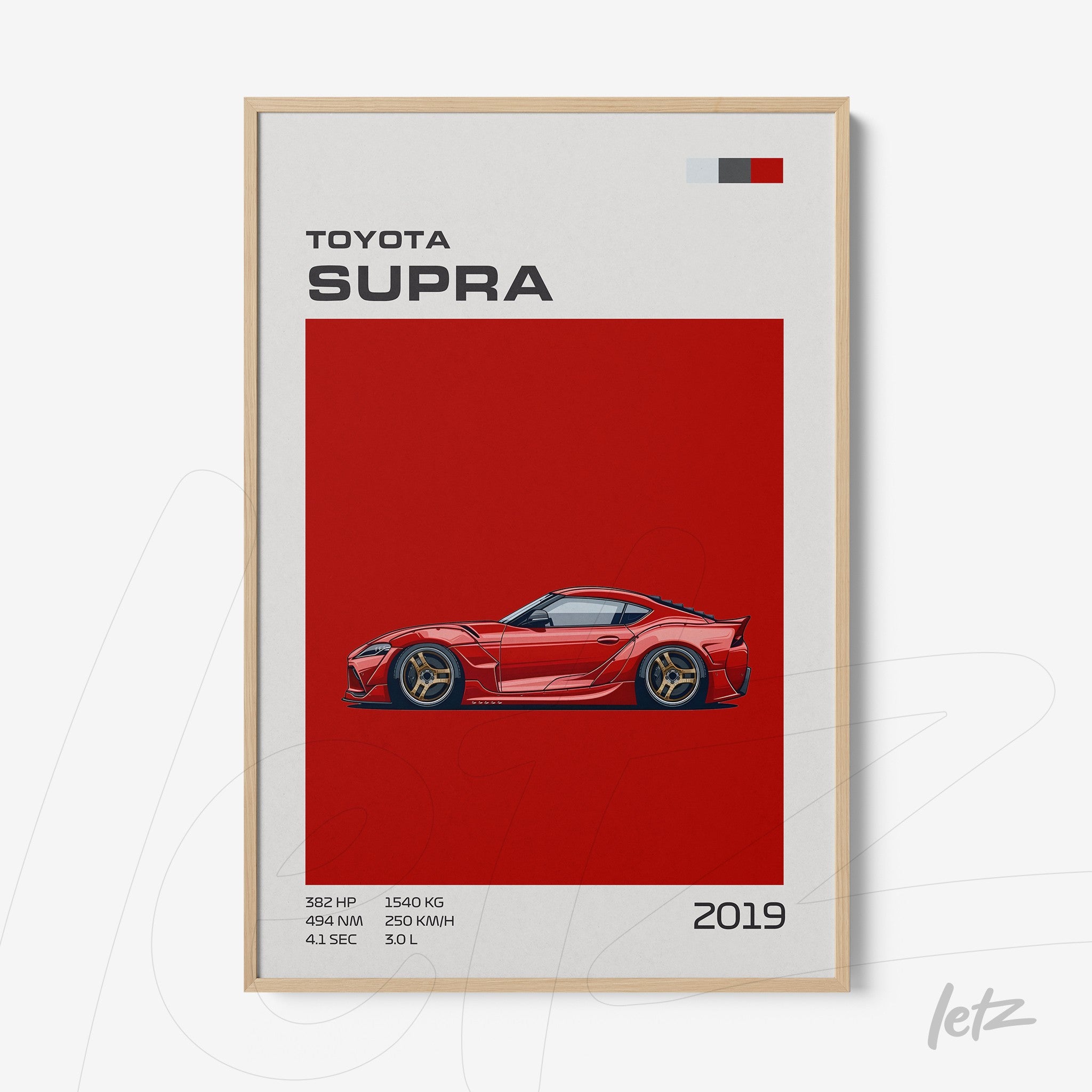 framed art featuring a toyota supra 2019 illustration in red background with light wood frame showcasing technical details beside it