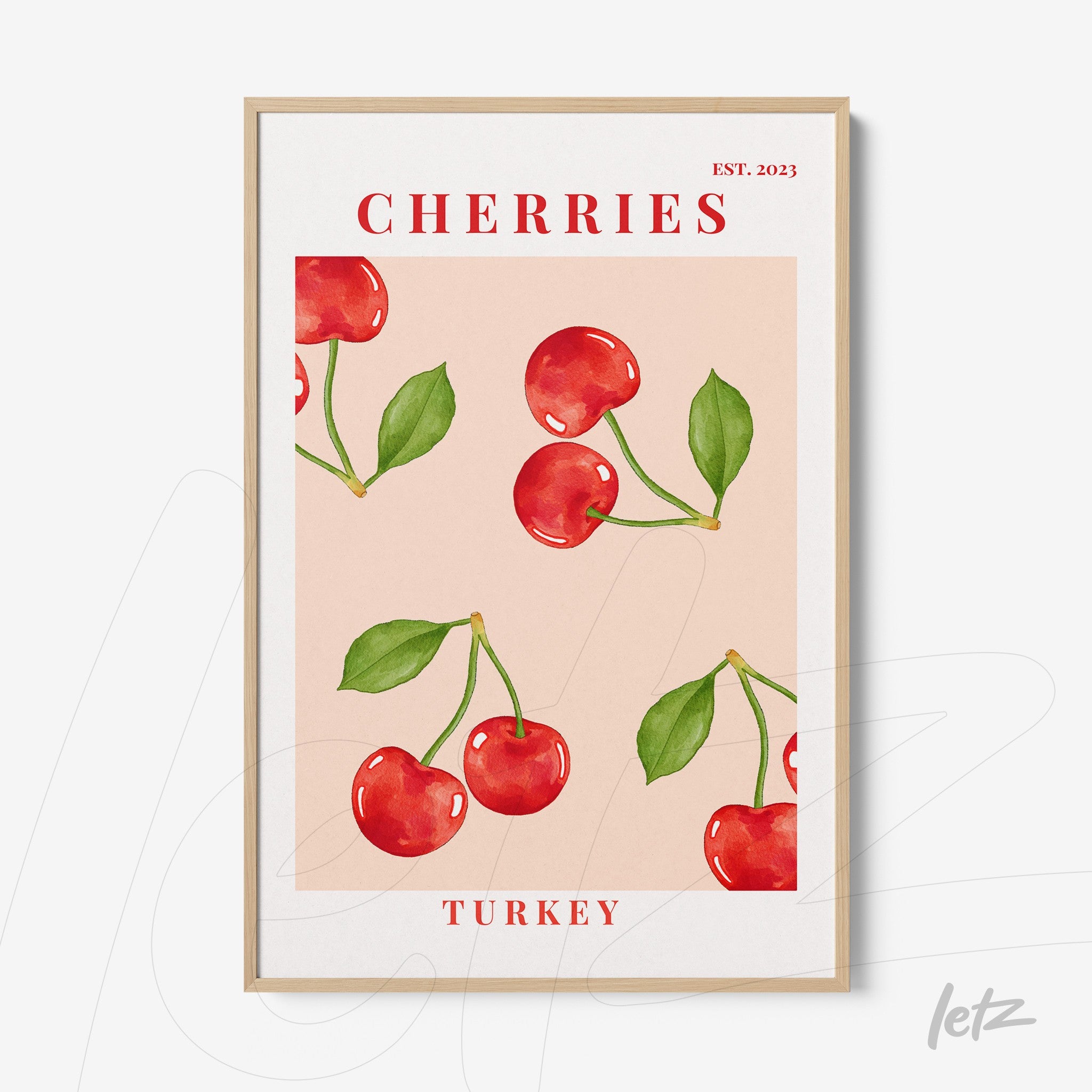framed wall art featuring cherry illustrations on light pink background with light wood frame