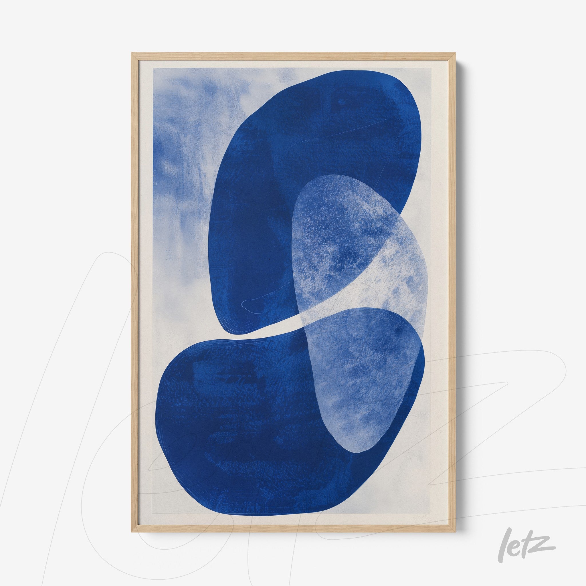 abstract wall art featuring blue organic shapes with a light wood frame