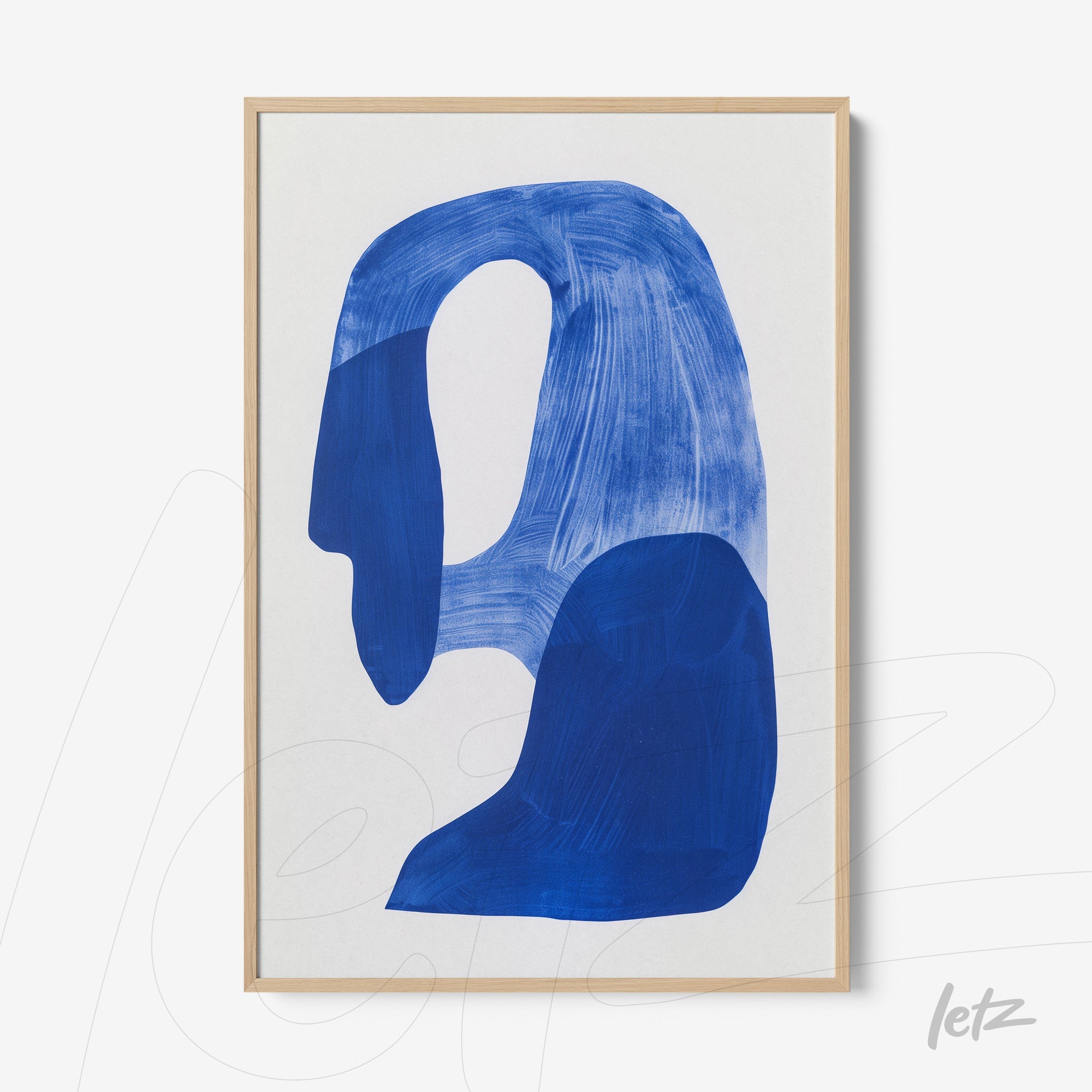 abstract wall art in shades of blue on white background with light wooden frame