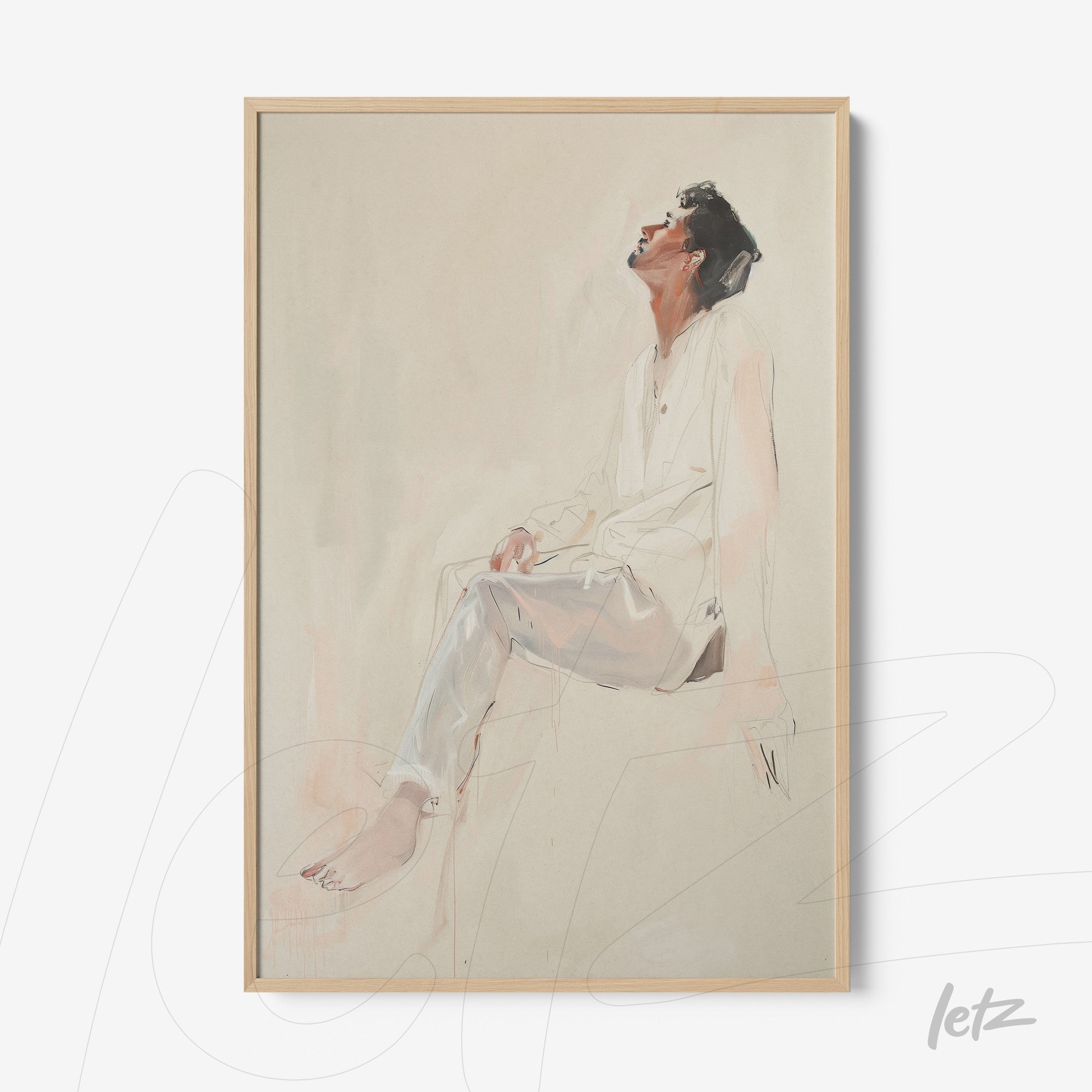 framed wall art featuring an artistic illustration of a man sitting in a reflective pose with a light wood frame on a neutral background