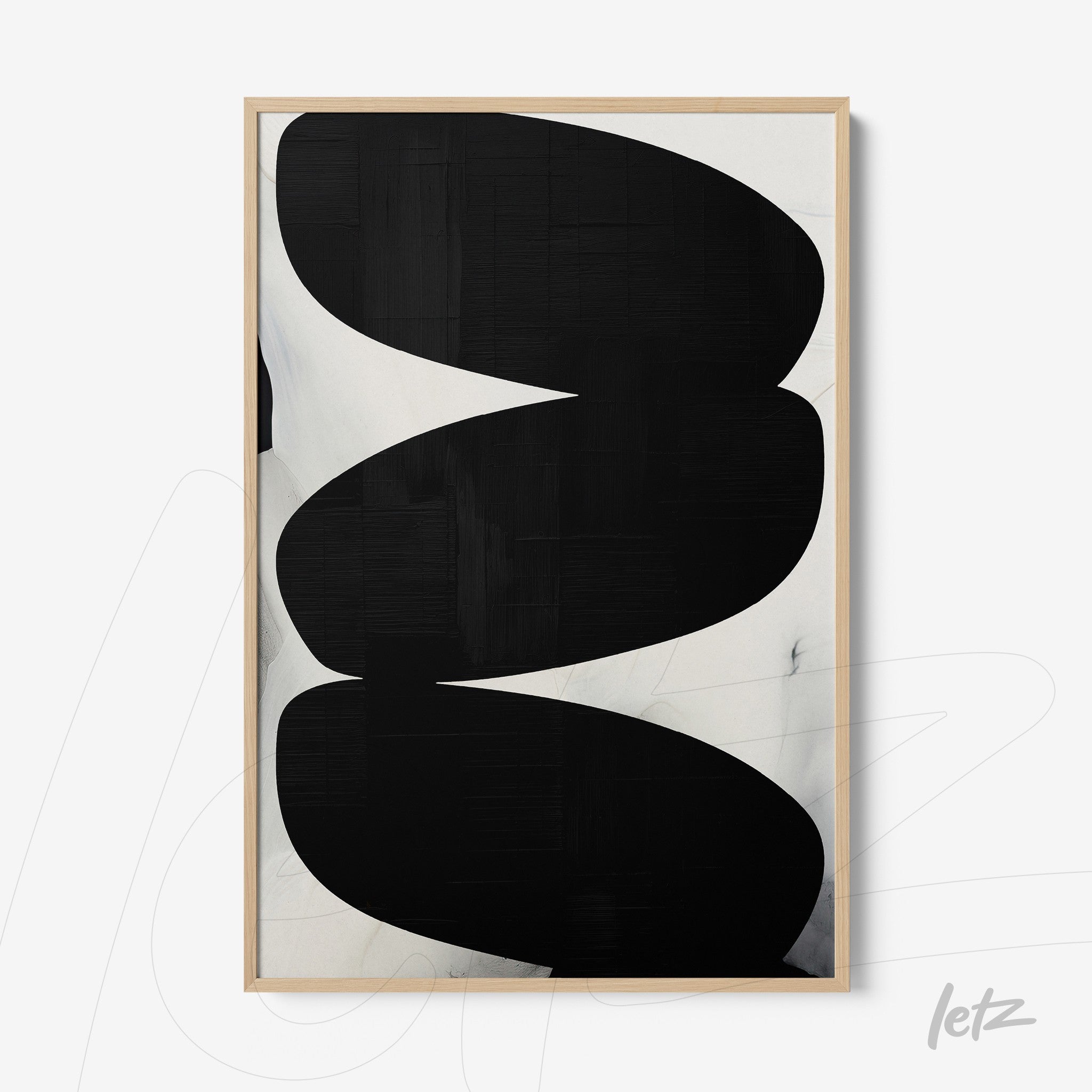 abstract wall art in black and white featuring organic shapes in light wood frame