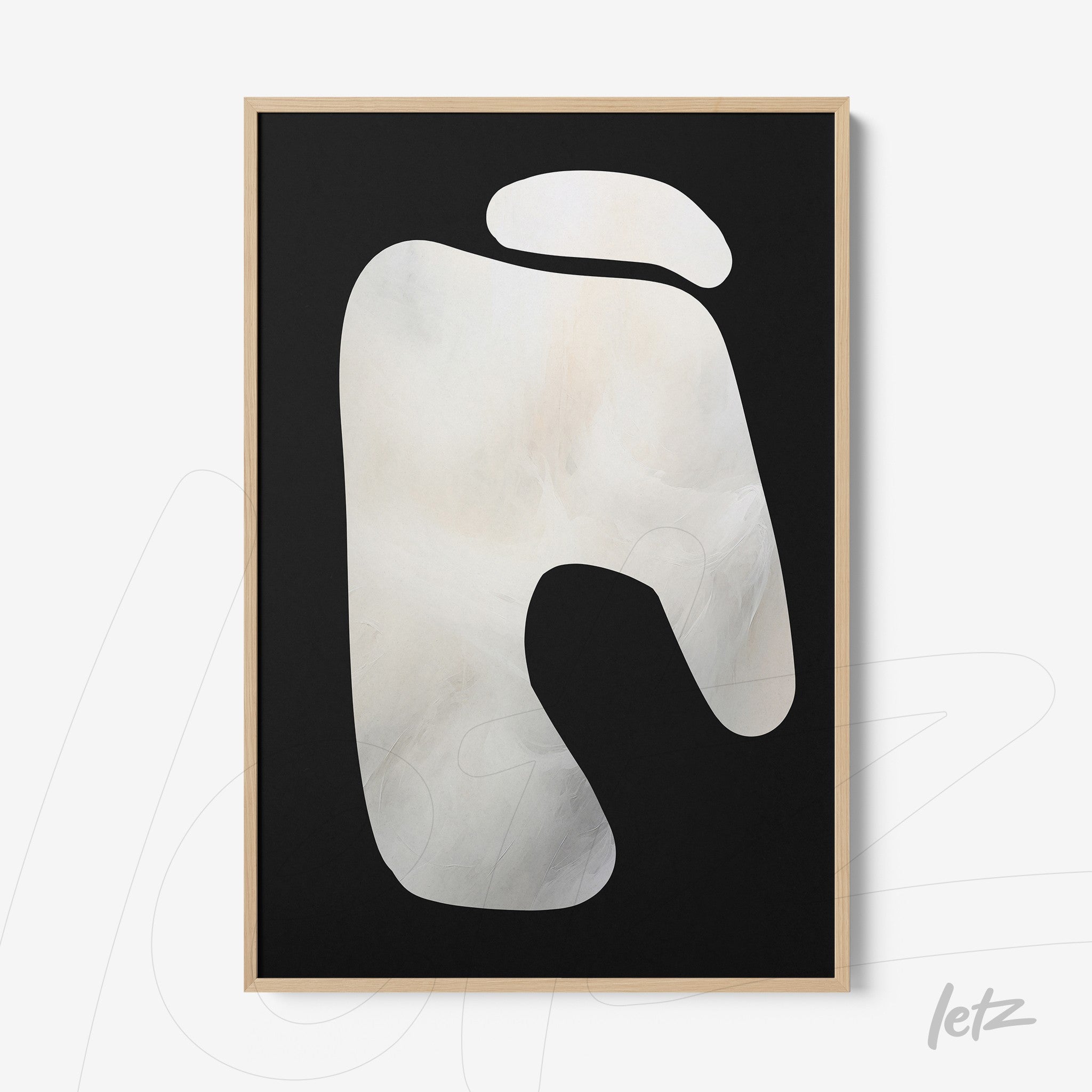 modern wall art featuring an abstract white shape on black background within a light wood frame