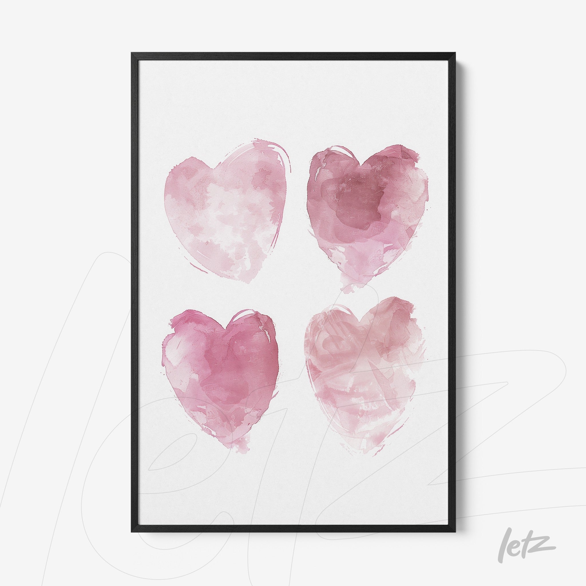 framed artwork featuring four watercolor hearts in shades of pink