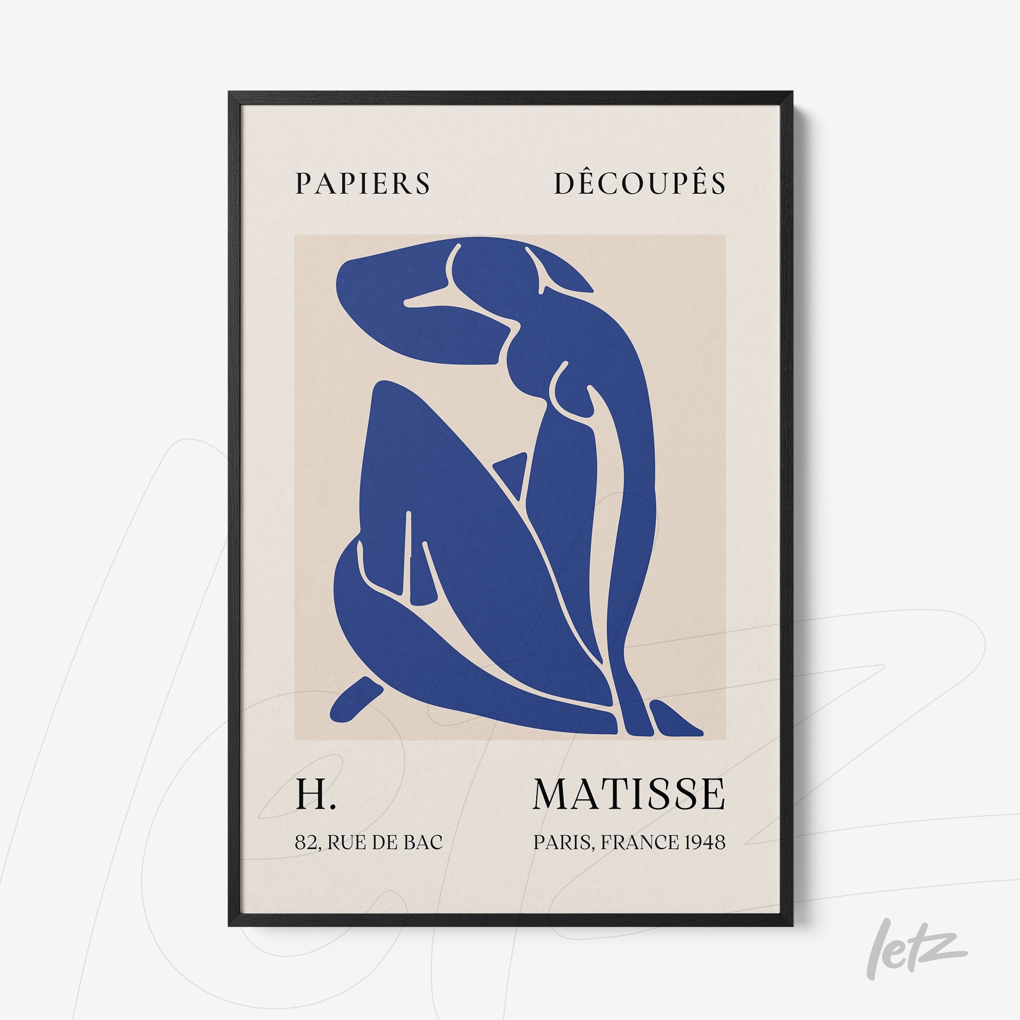 decorative framed artwork by Matisse featuring a blue cut-out of a female figure on cream background with black frame