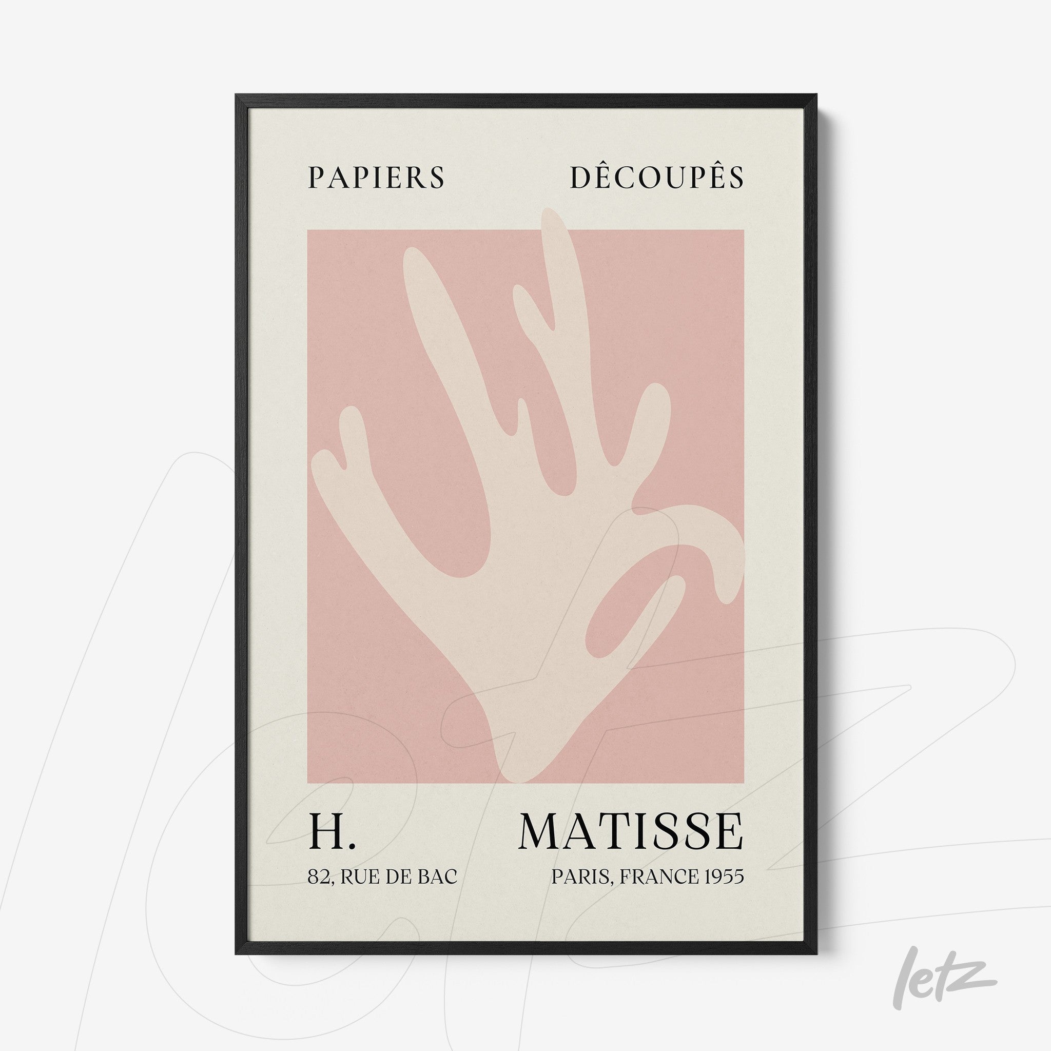 framed wall art featuring a modern minimalistic design of a hand on a pink background