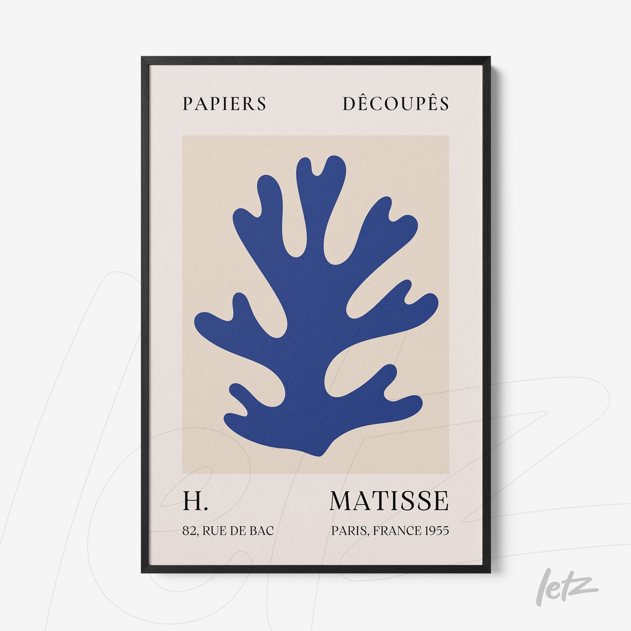 framed wall art with organic cut-out shapes in blue on light background