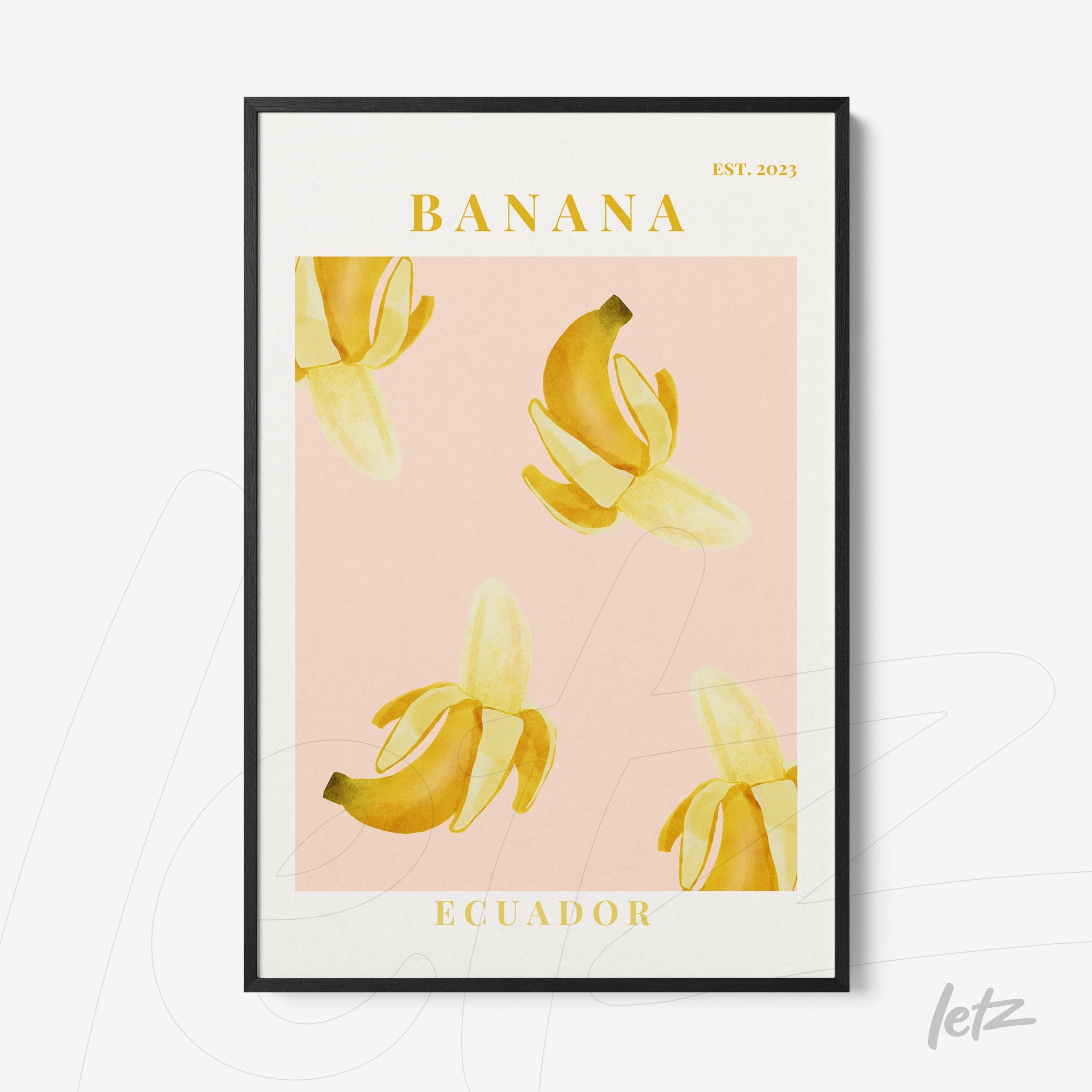 framed art featuring yellow bananas on a light pink background with black frame and prominent text at the top