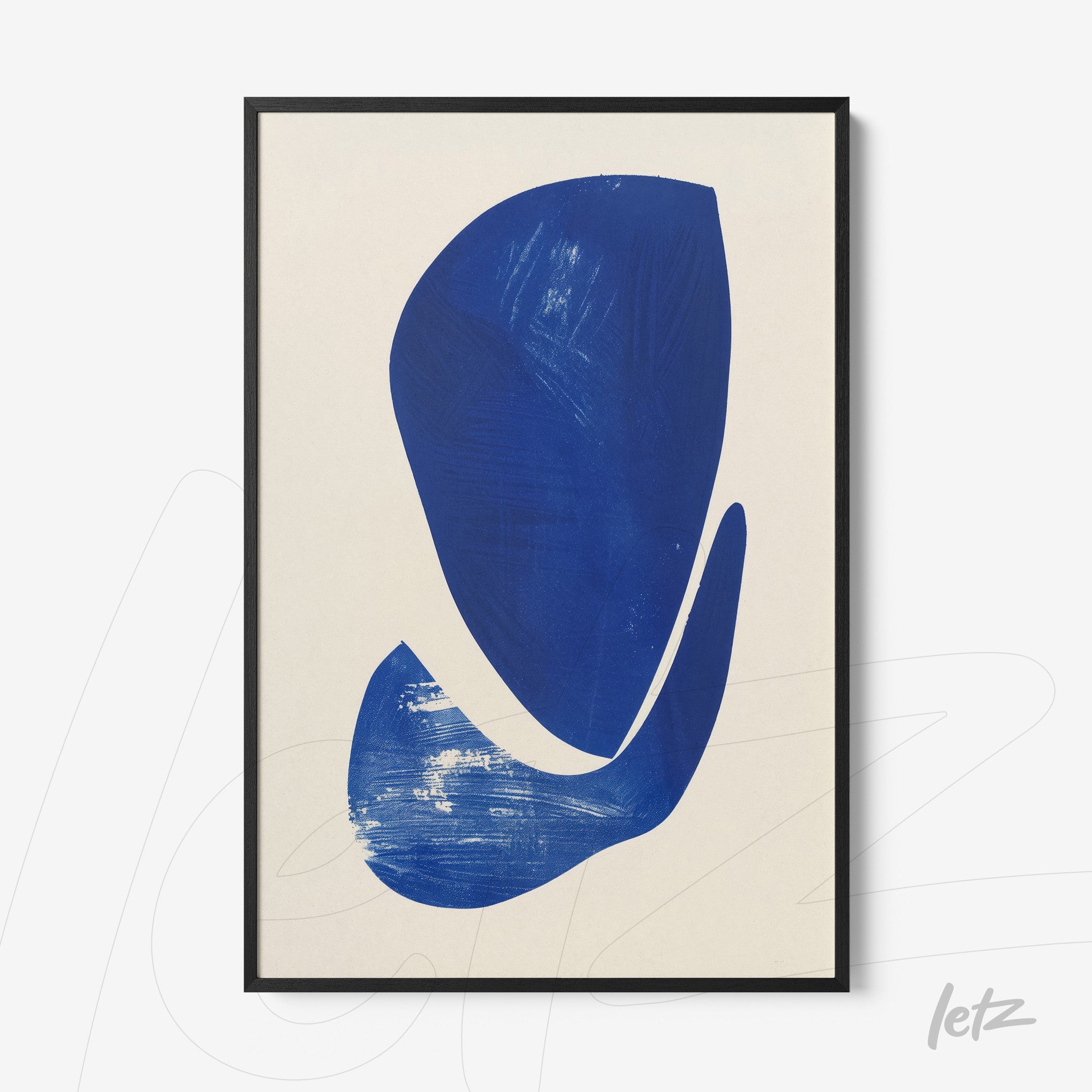 abstract wall art featuring bold blue shapes on light background in black frame