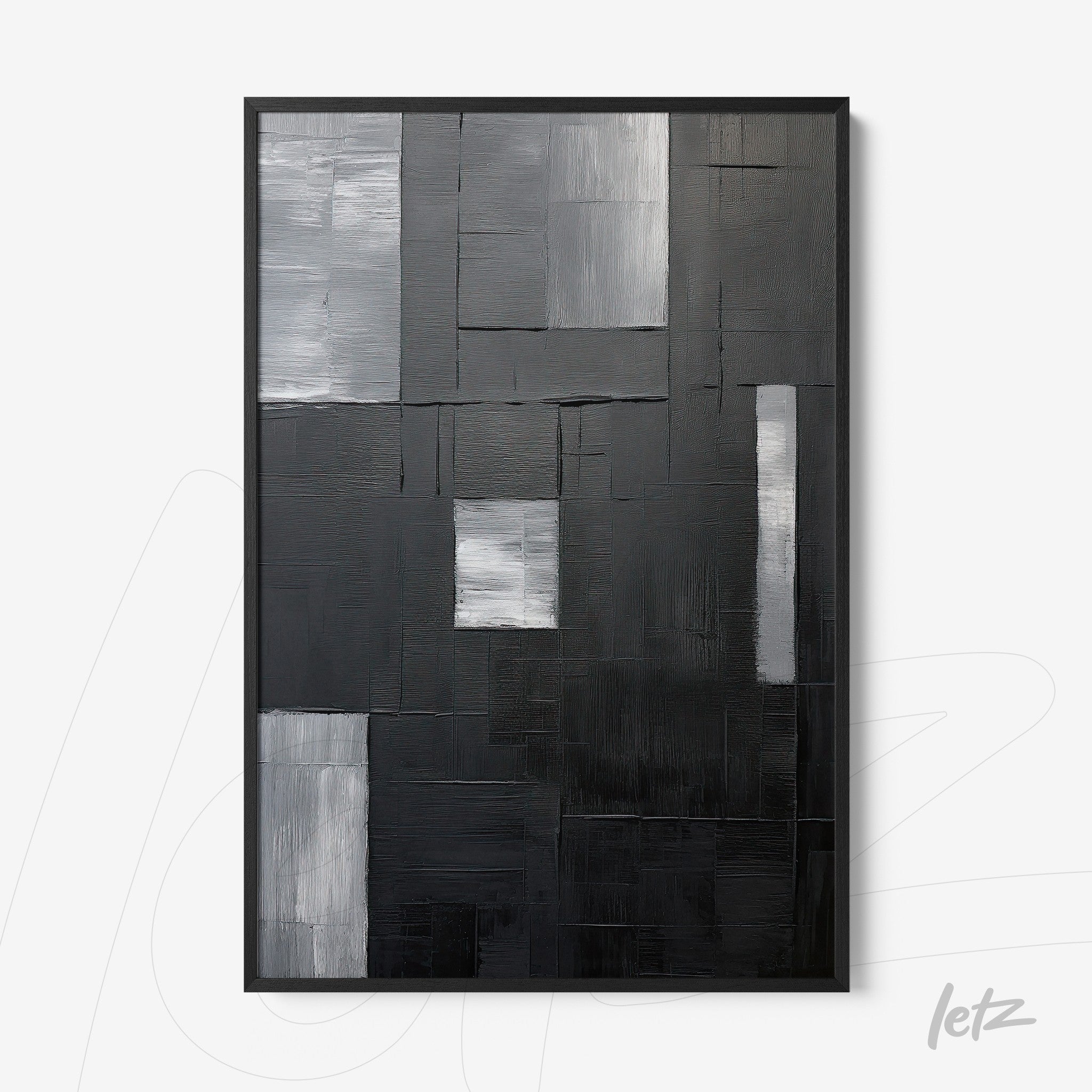 abstract wall art in black and gray featuring multiple textures in black frame
