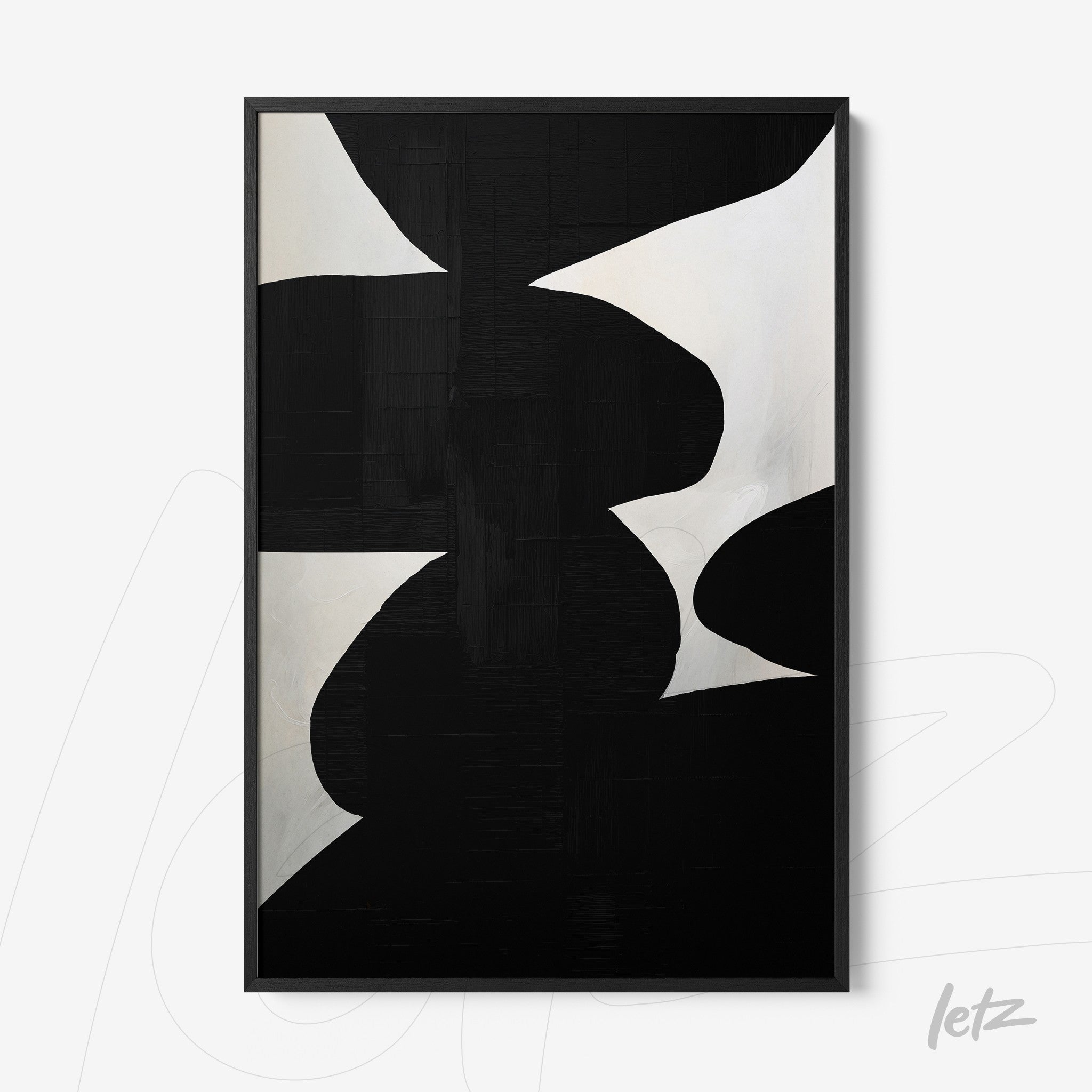 abstract black and white wall art displayed in a thin black frame