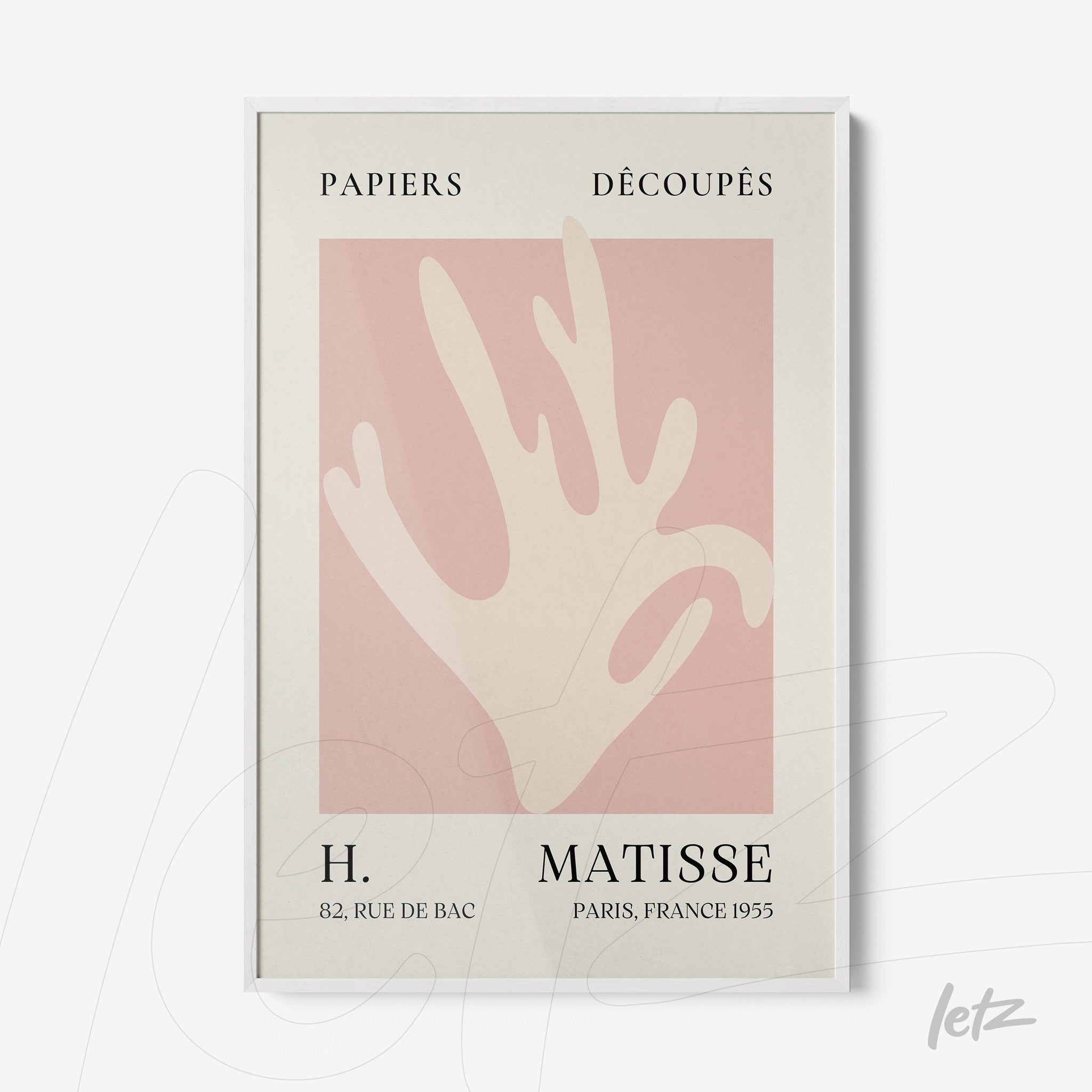 framed contemporary art featuring a stylized hand on a light pink background with a white frame
