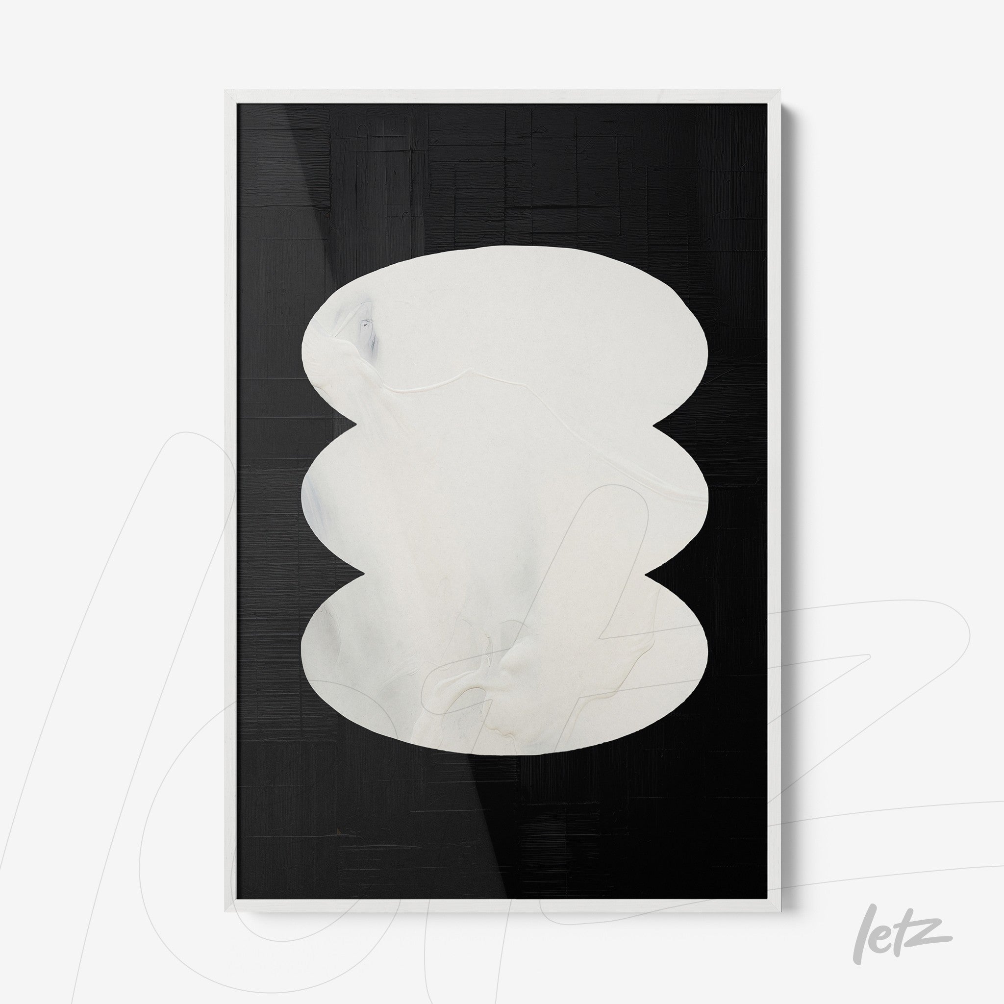 framed abstract wall art in black and white with a white organic shape