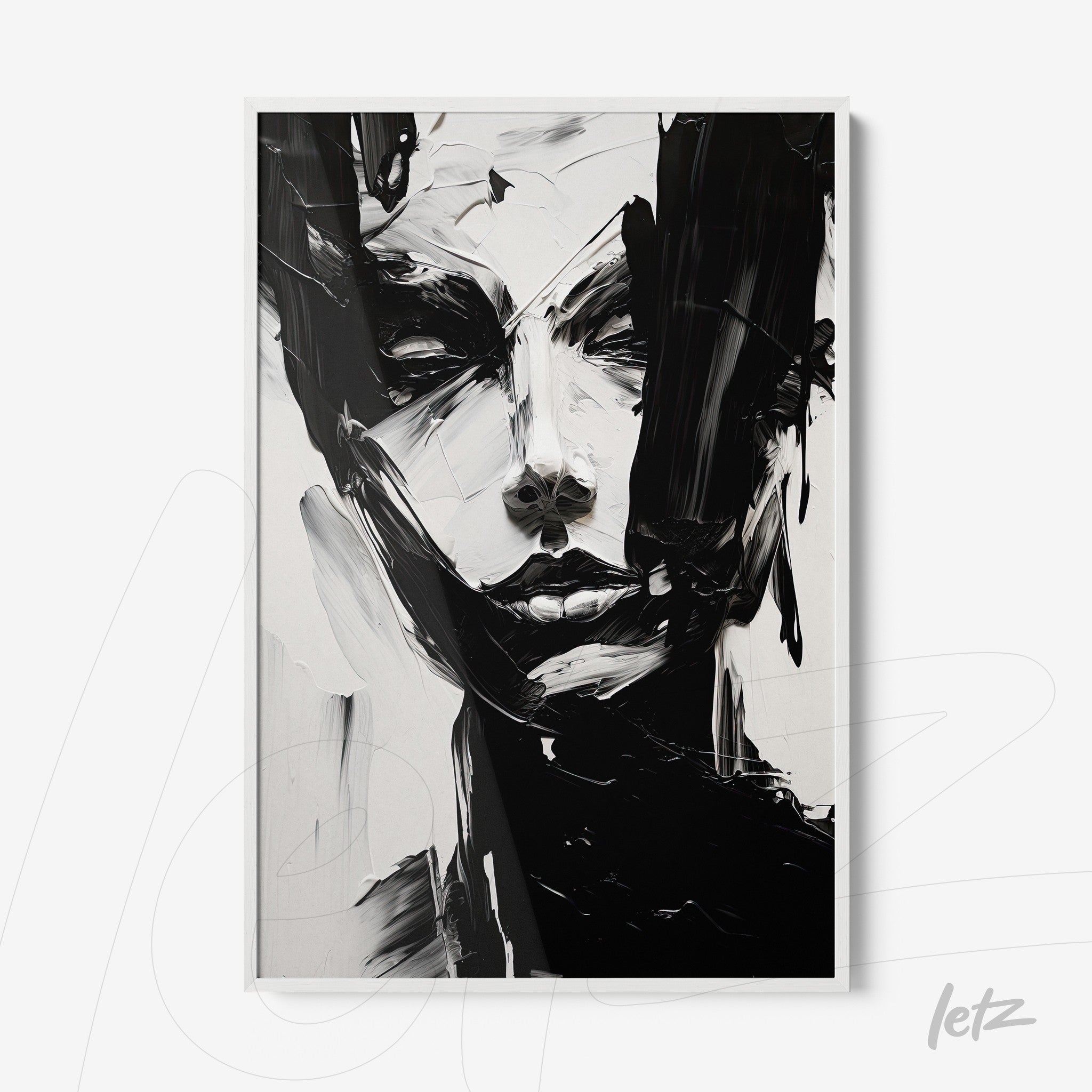 abstract wall art in black and white featuring an expressive human face with loose brush strokes in a white frame