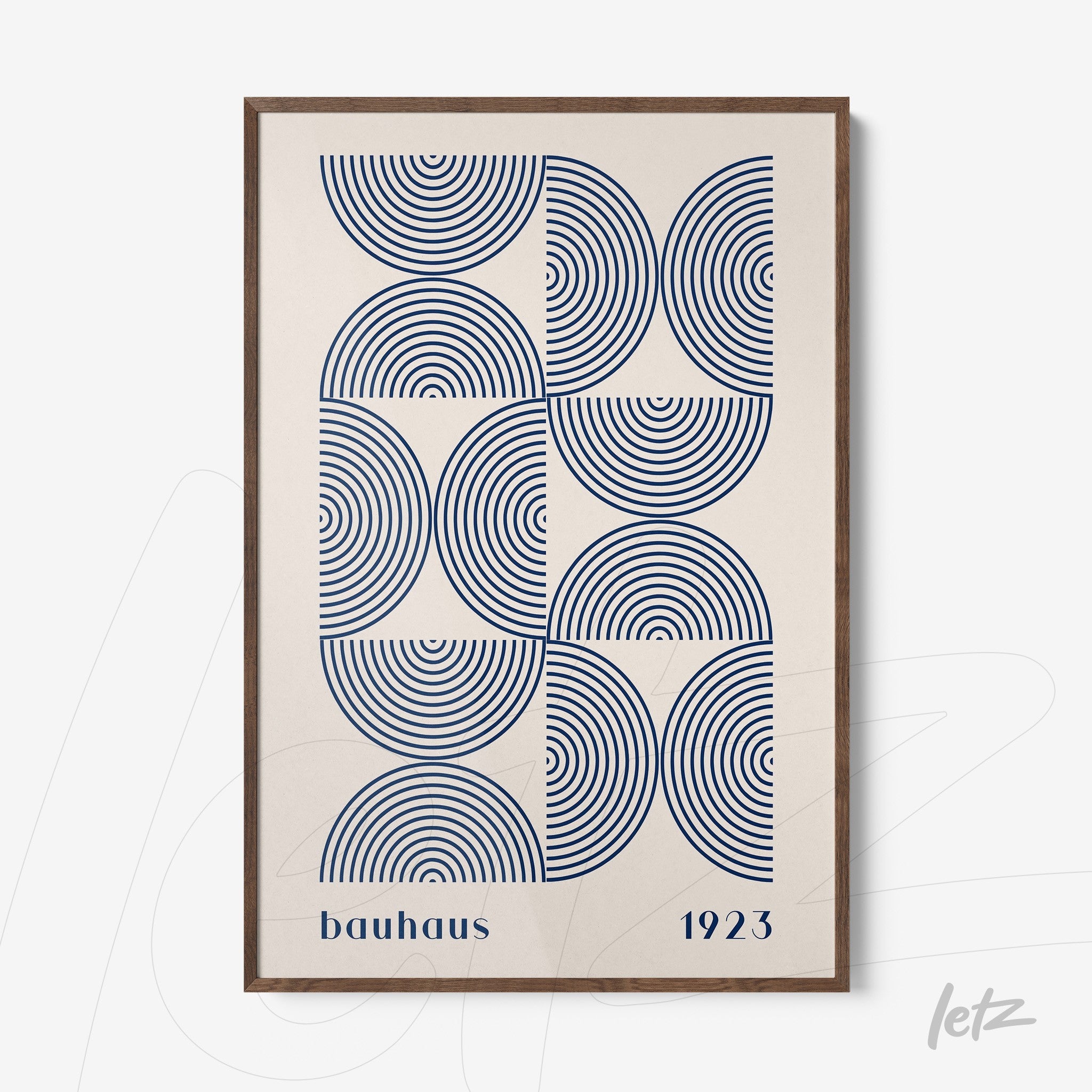 framed geometric Bauhaus style art featuring blue concentric circles and the text 'bauhaus 1923' in a brown frame
