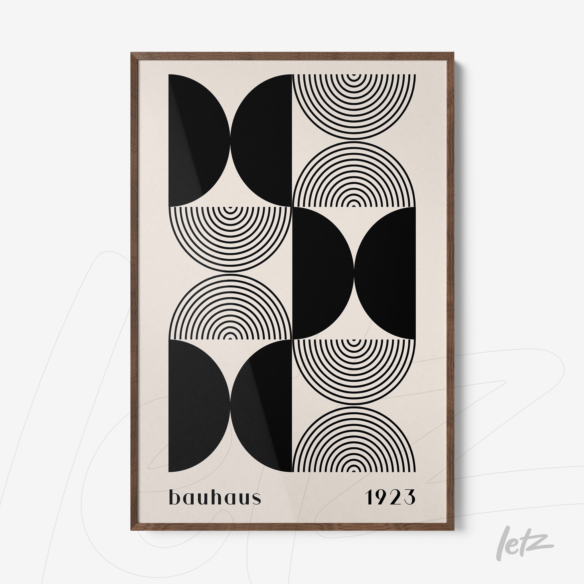 framed geometric design inspired by bauhaus featuring black circles and semicircles with wooden frame