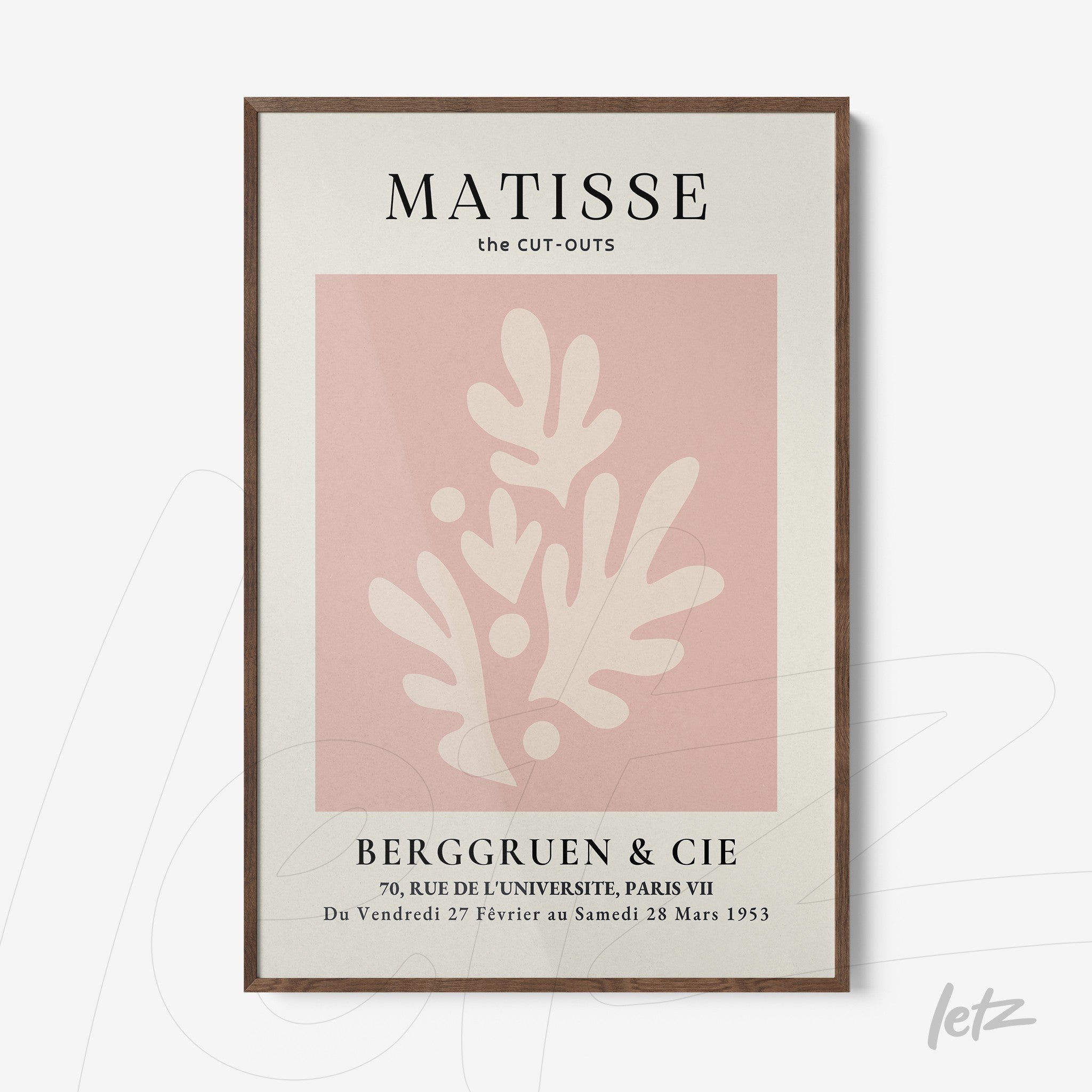 framed modern art print featuring organic shapes on pink background with dark wood frame