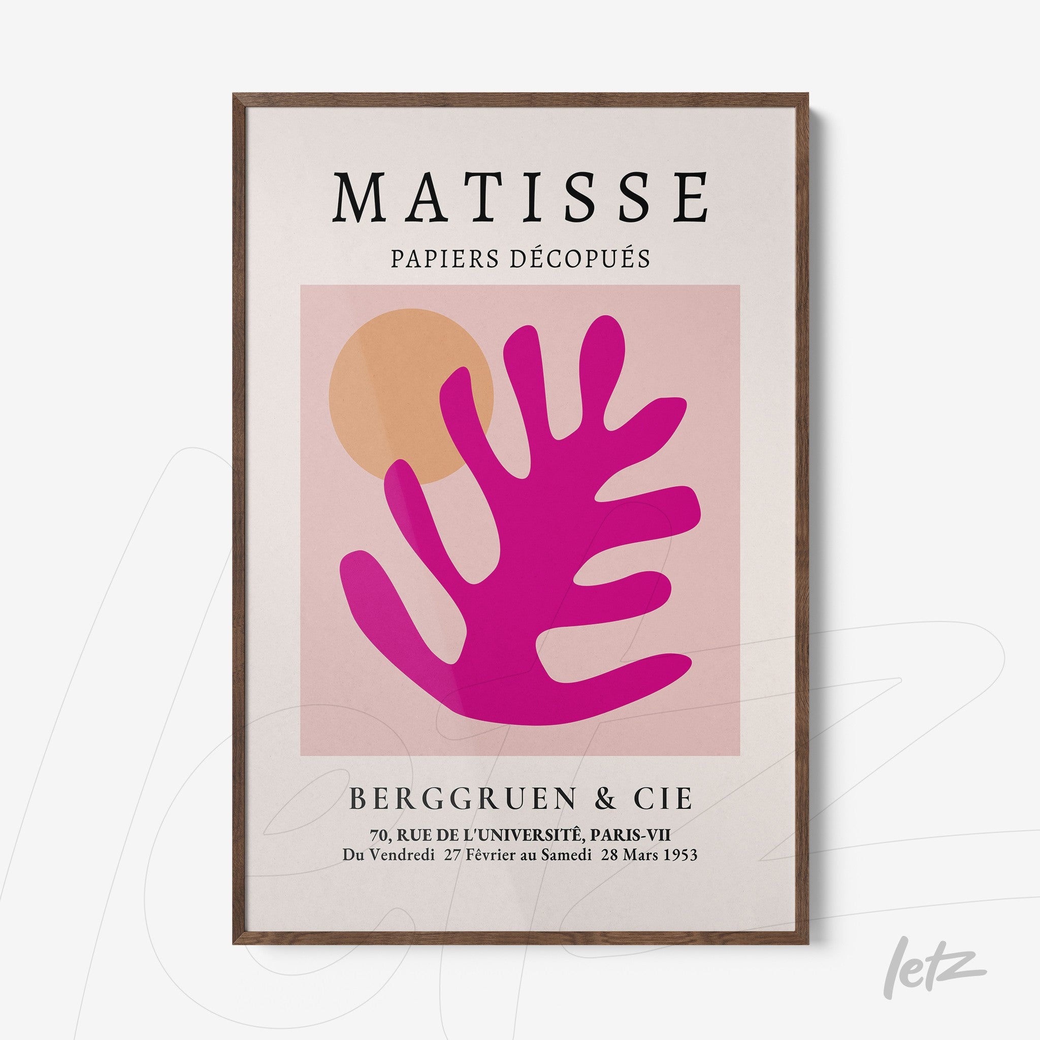 modern wall art featuring organic shapes in pink and orange tones, framed in dark wood