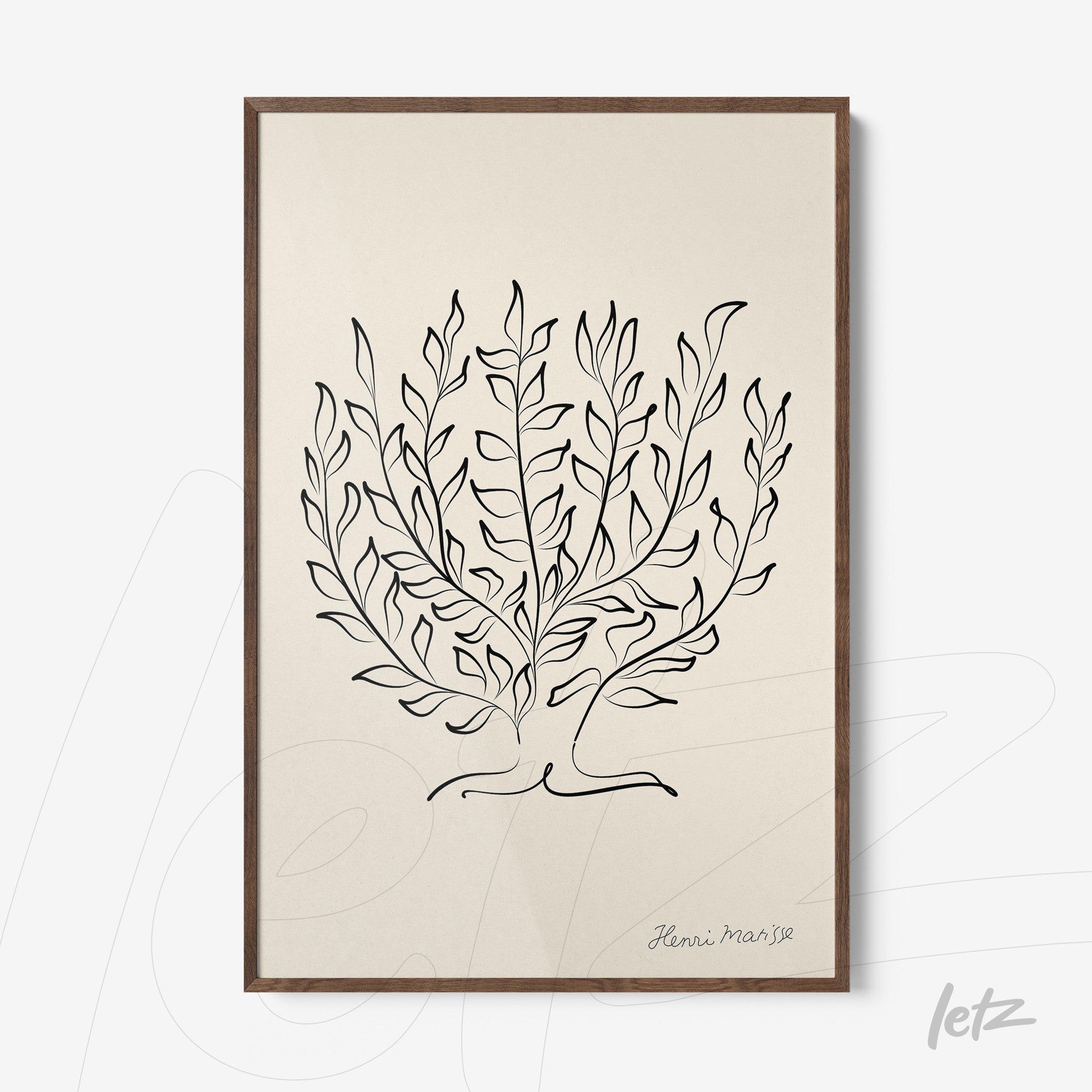 framed artwork featuring a minimalist drawing of leaves in black line against a light background with dark wood frame