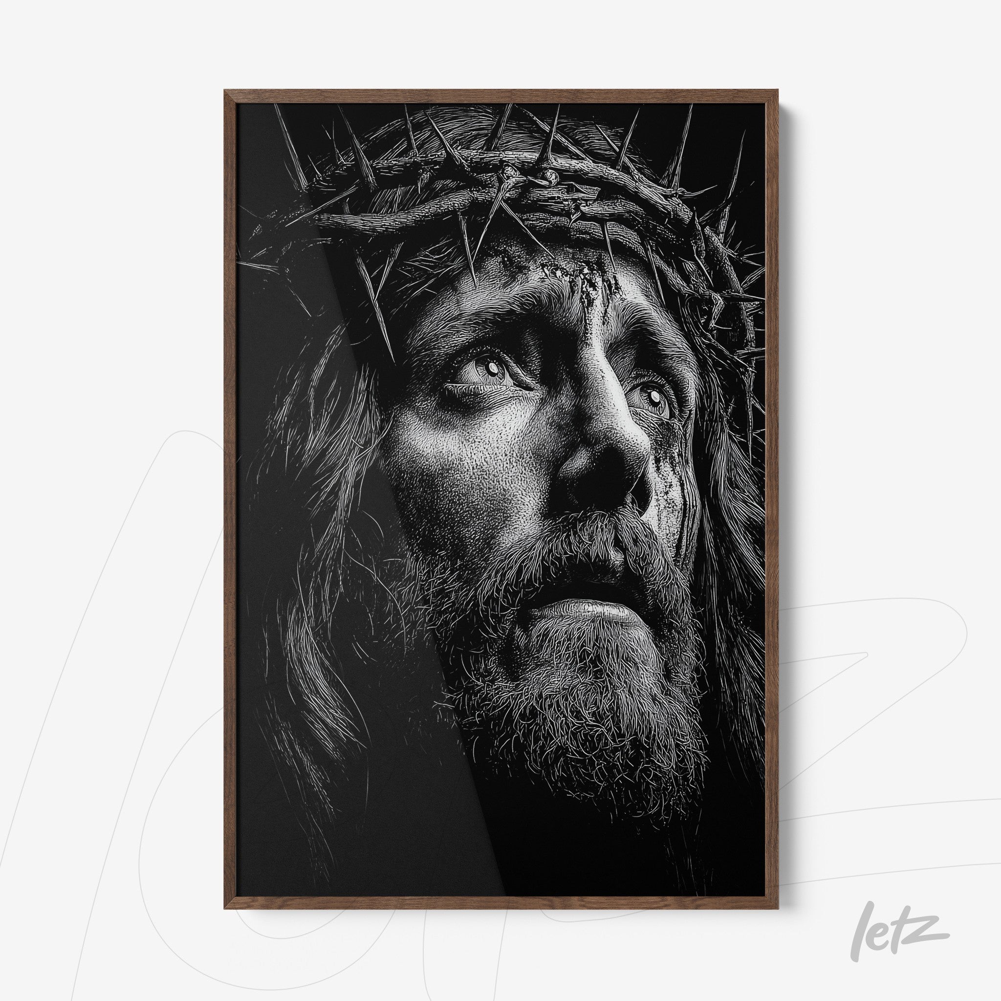 black and white framed wall art of a religious portrait featuring detailed thorn crown with dark wood frame