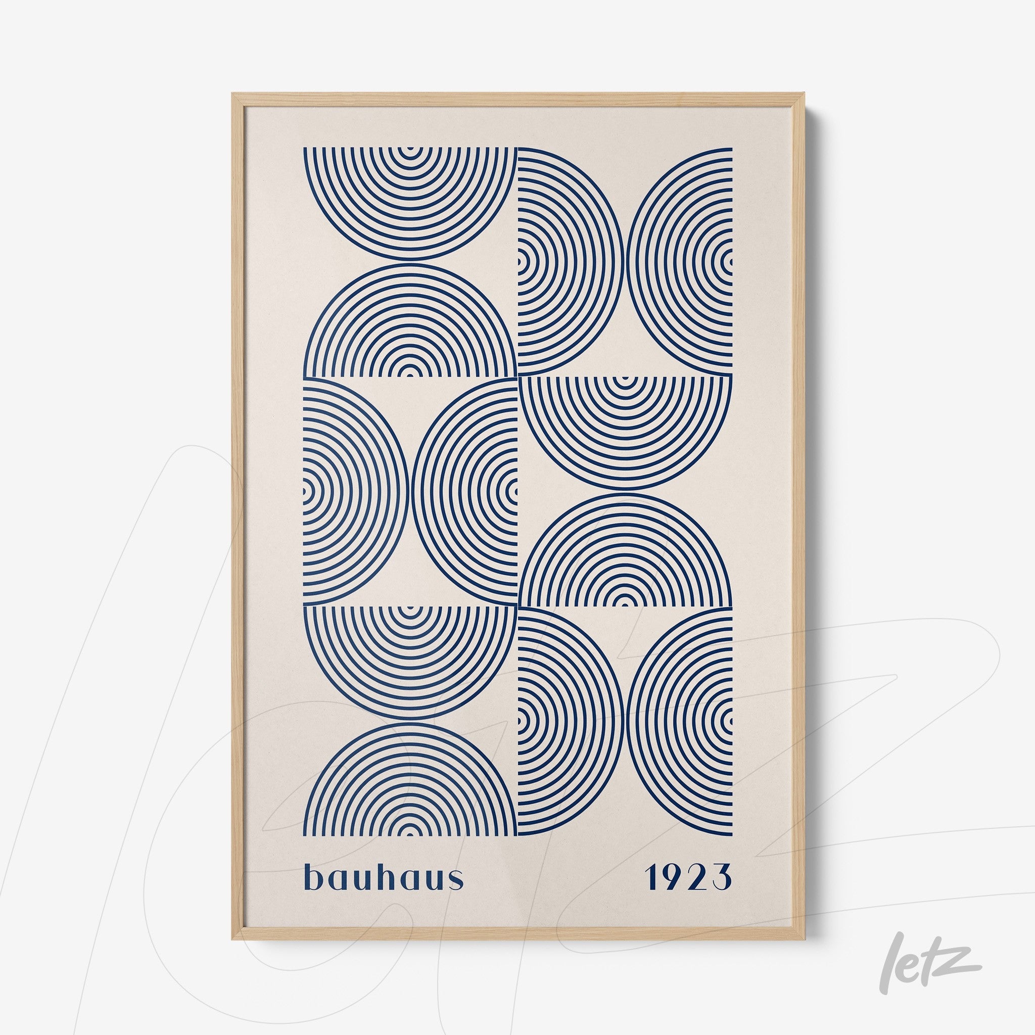 canvas print featuring bauhaus geometric art with concentric blue circles on a light background and a light wood frame